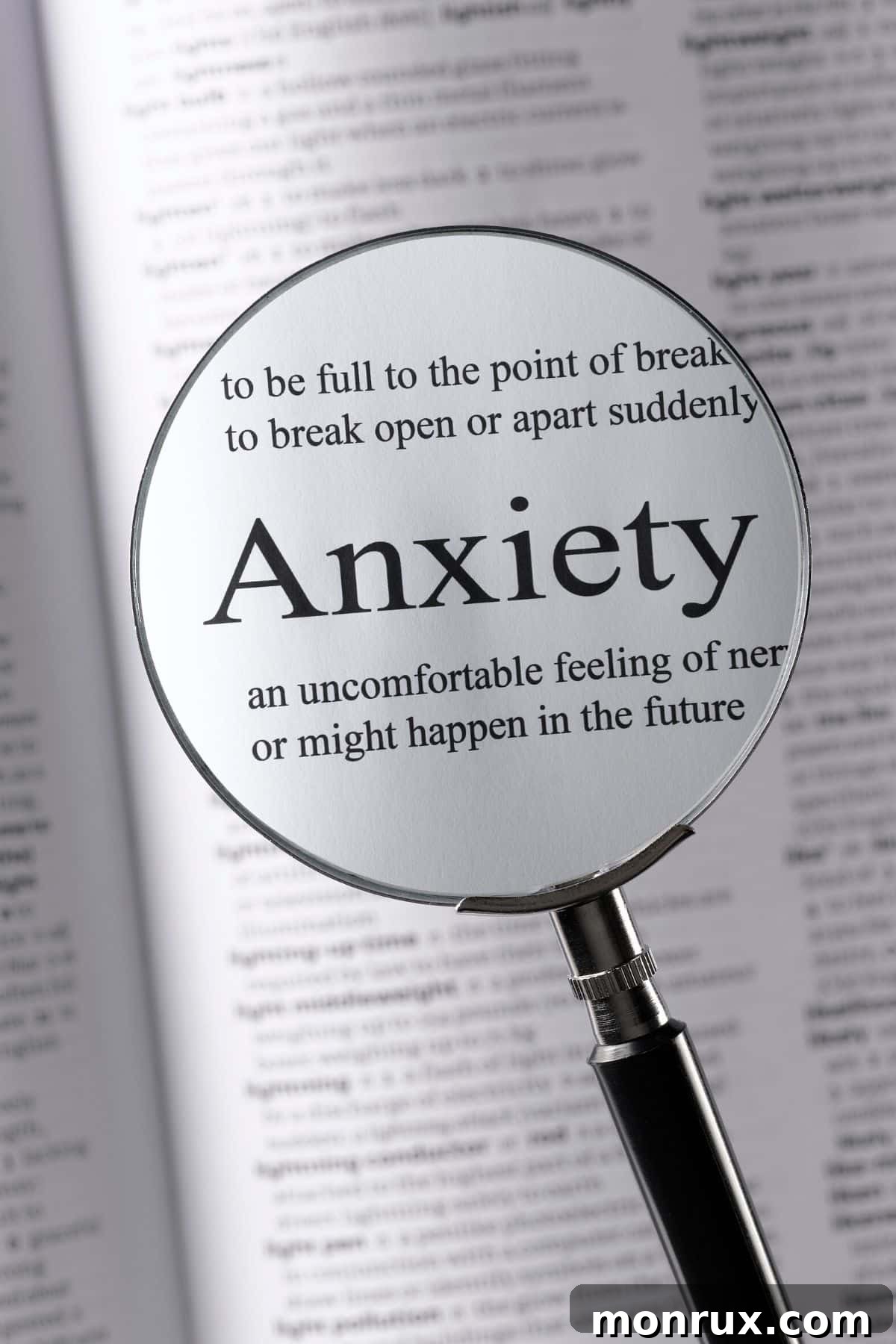 A magnifying glass rests on the word 'anxiety', symbolizing a focused examination of the topic. The image suggests a deep dive into understanding and addressing anxiety, particularly in the context of perimenopause and natural remedies.