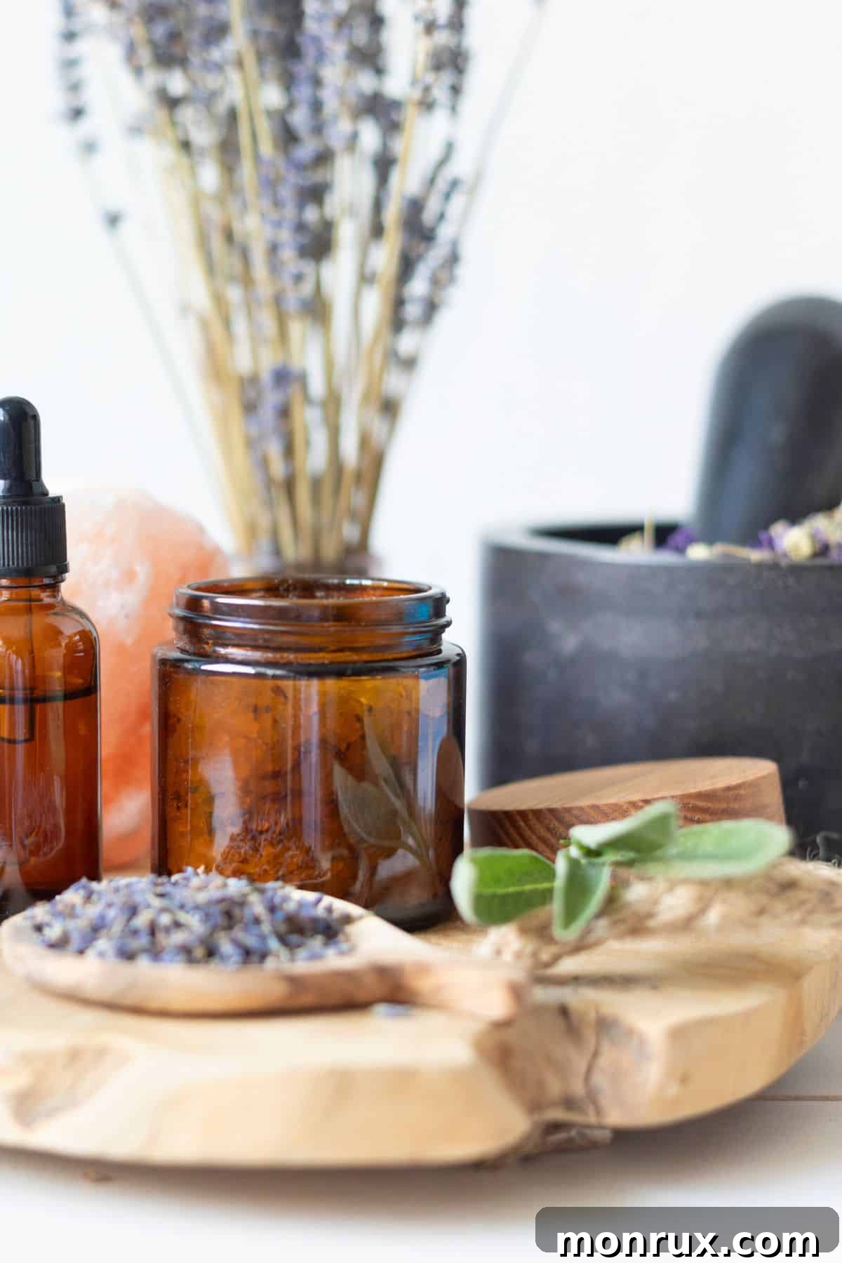 An array of herbal treatments and natural remedies, including sprigs of lavender and various botanical ingredients, are artfully arranged on a wooden table, suggesting a focus on traditional and holistic healing.