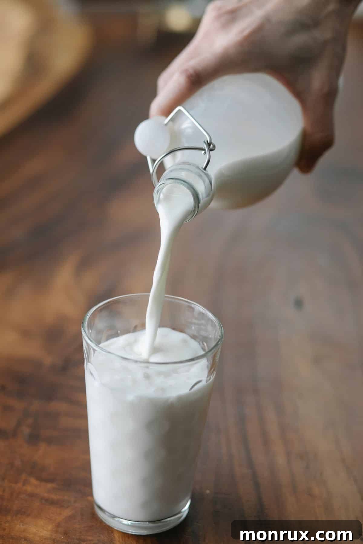 pouring milk into a glass.