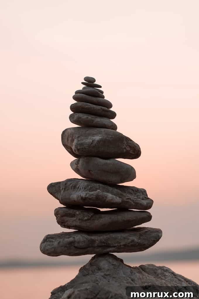A balanced stack of meditative rocks, symbolizing stability, calm, and present-moment awareness.