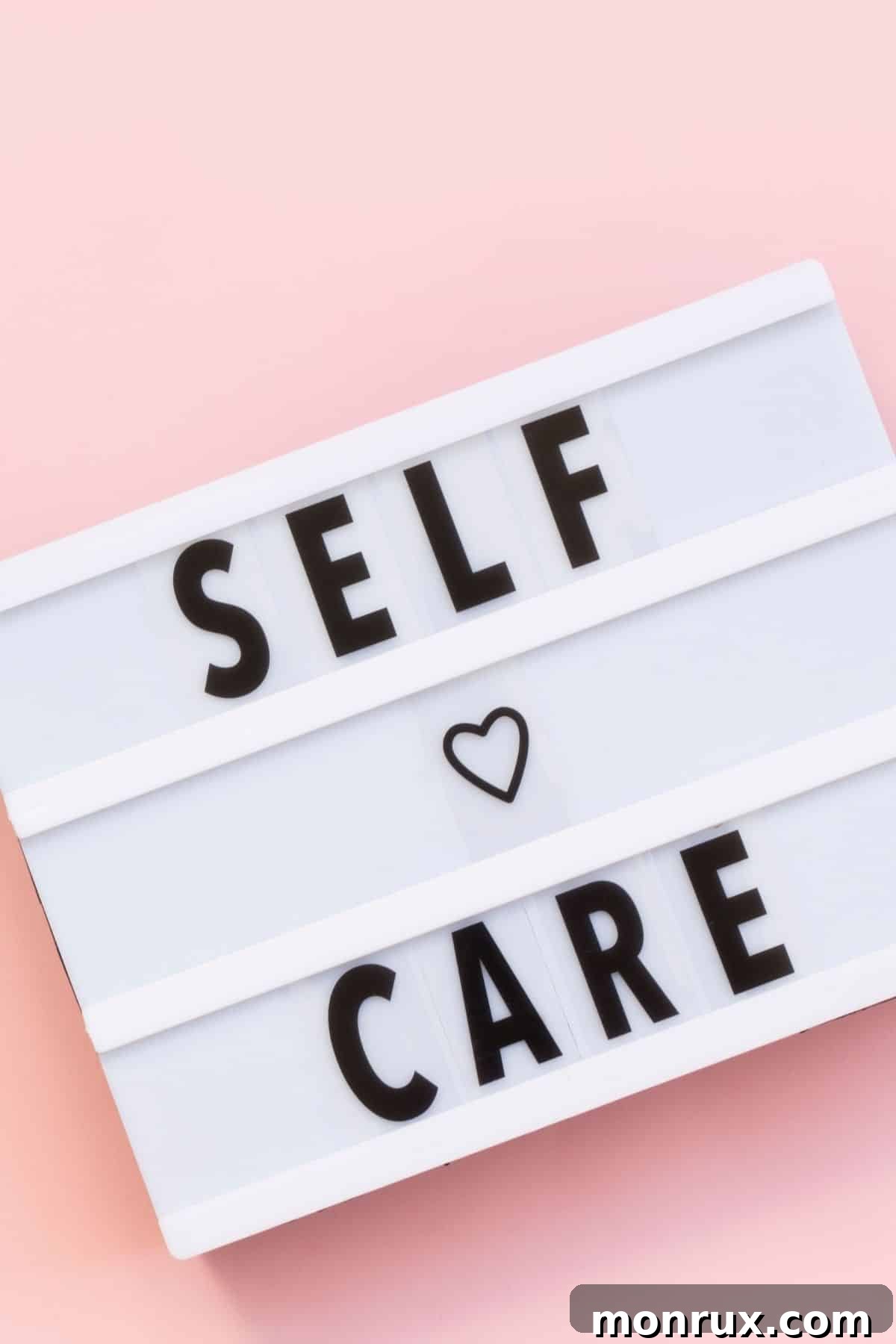 A vibrant sign with 'Self-Care' prominently displayed in bold black letters, symbolizing the importance of personal well-being.