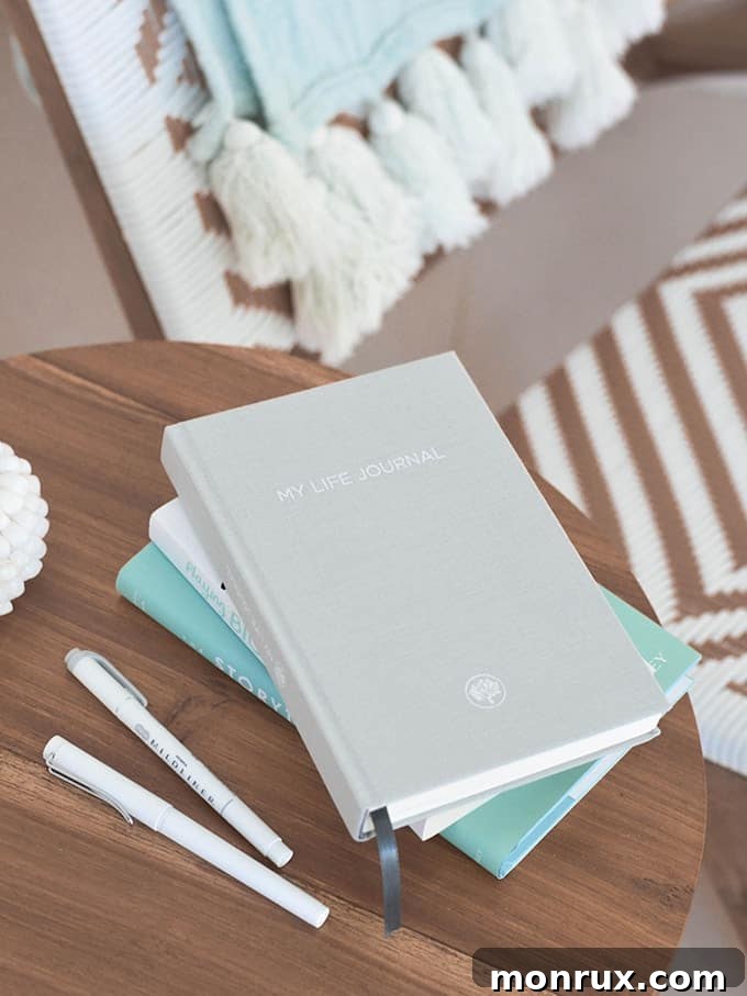 gratitude journal with pen and flowers.