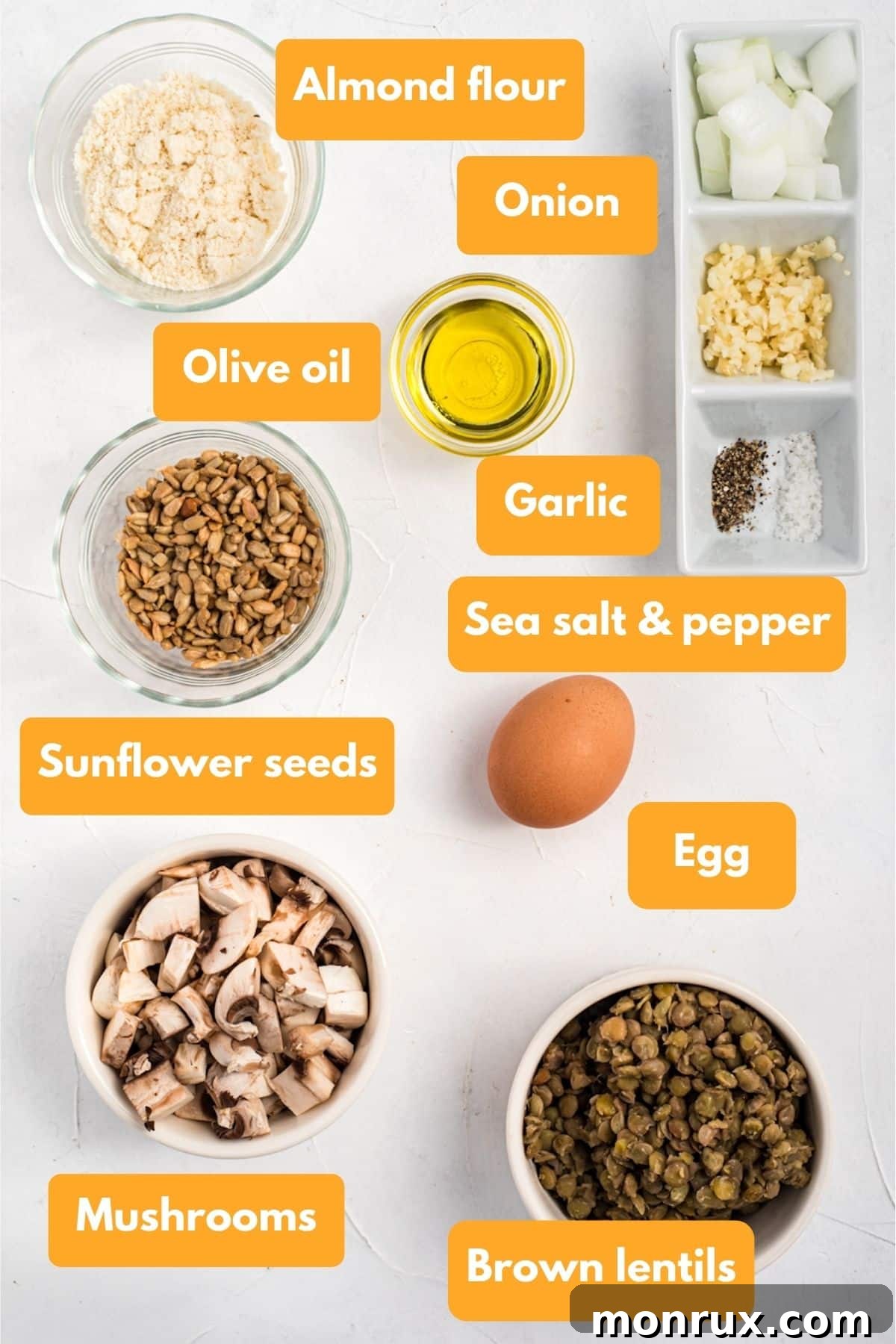 A flat lay of fresh ingredients for making gluten free lentil burgers, including lentils, mushrooms, and almond flour.