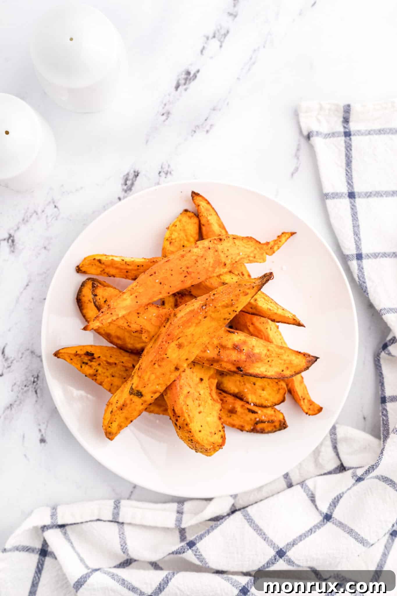 Air fried sweet potato wedges served in a rustic bowl, ready to eat.