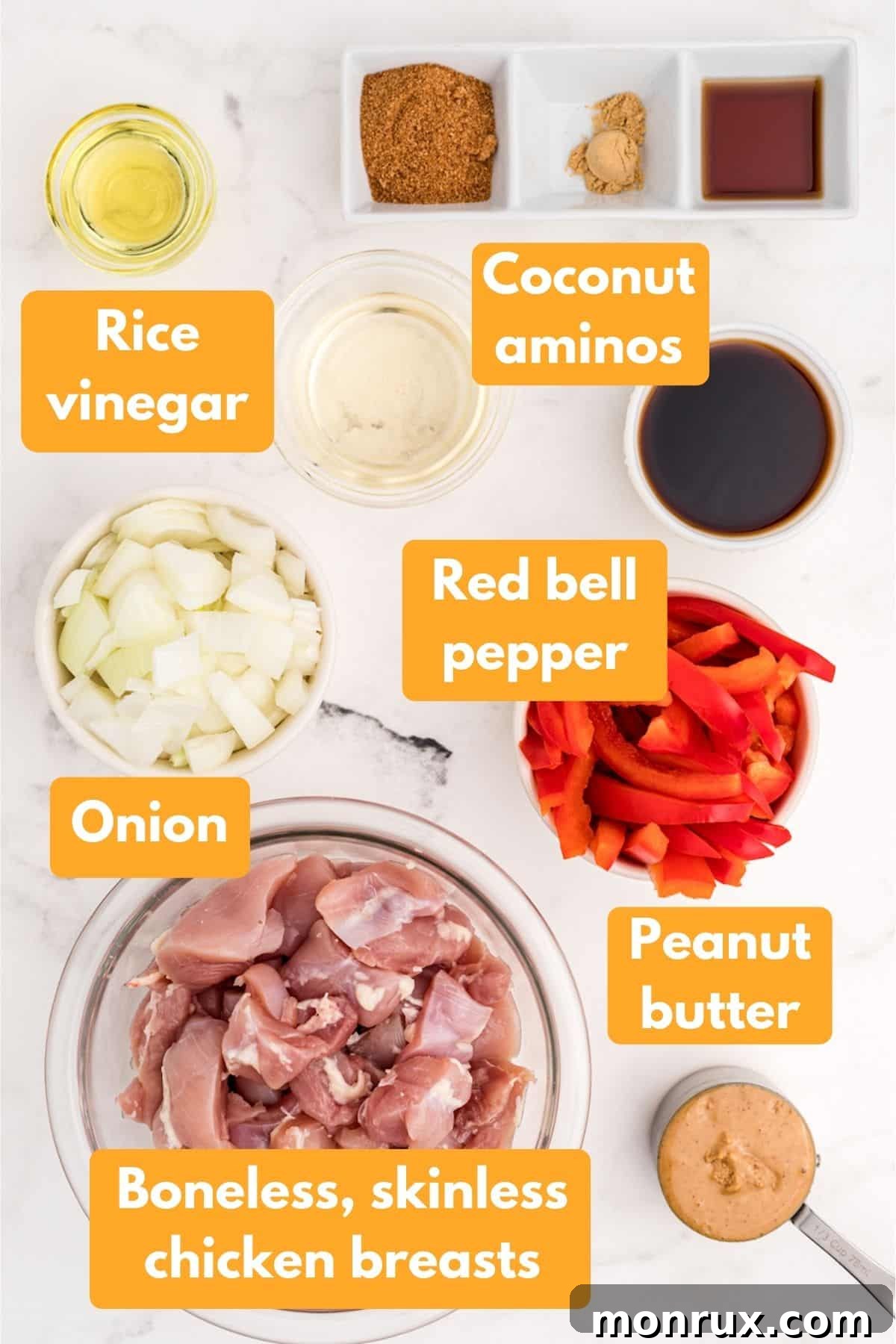 Key ingredients laid out for peanut butter chicken preparation
