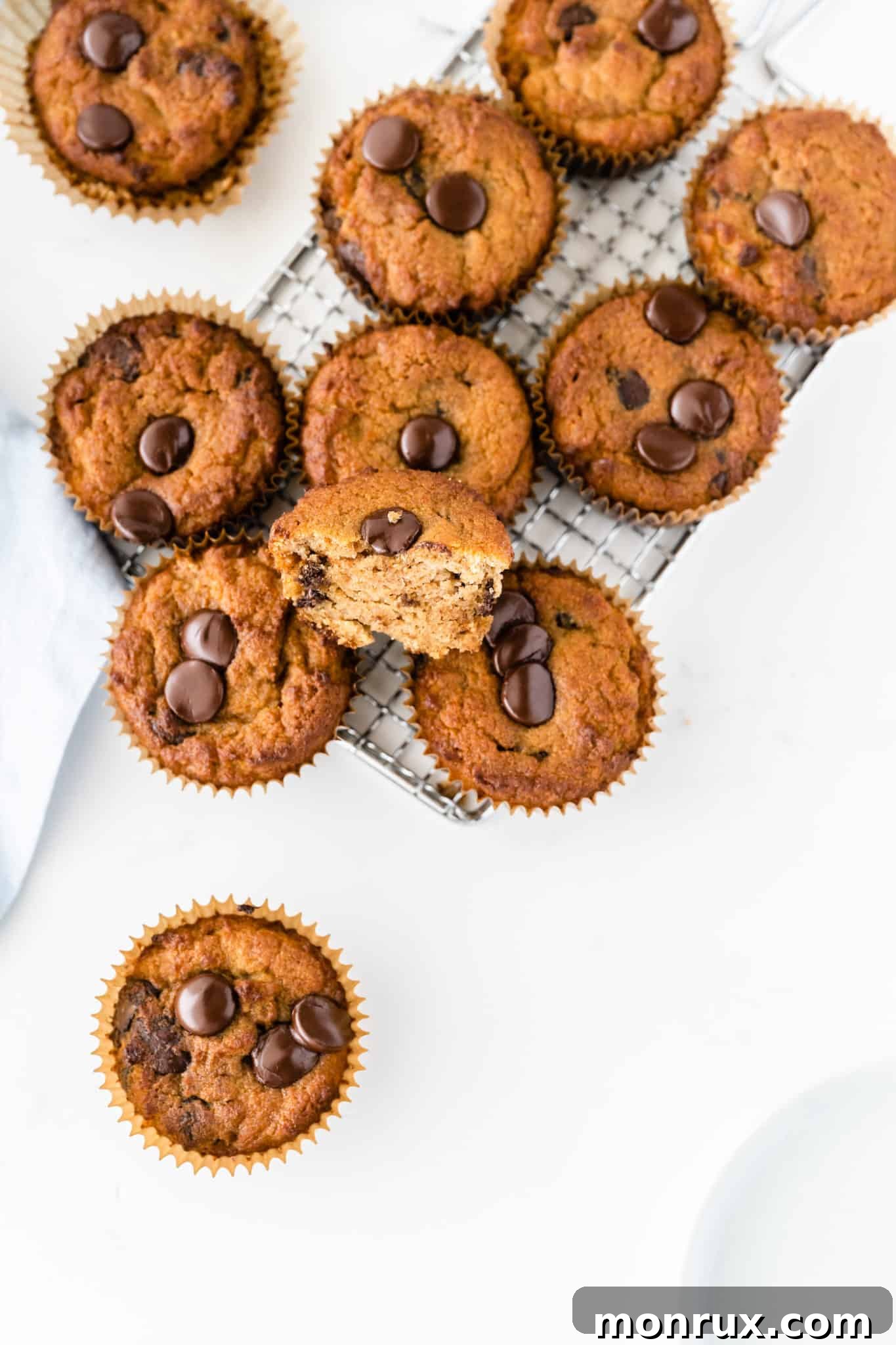 Freshly baked coconut flour muffins cooling on a wire rack.