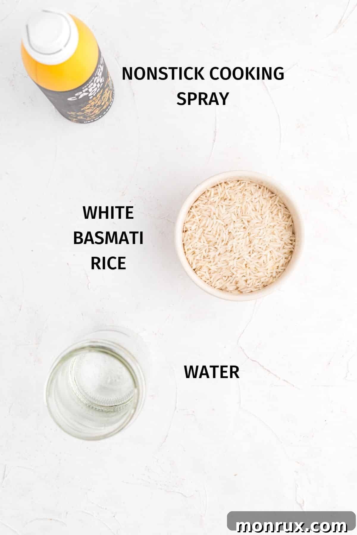 Essential ingredients laid out for making Instant Pot Basmati rice: rice, water, and cooking spray.