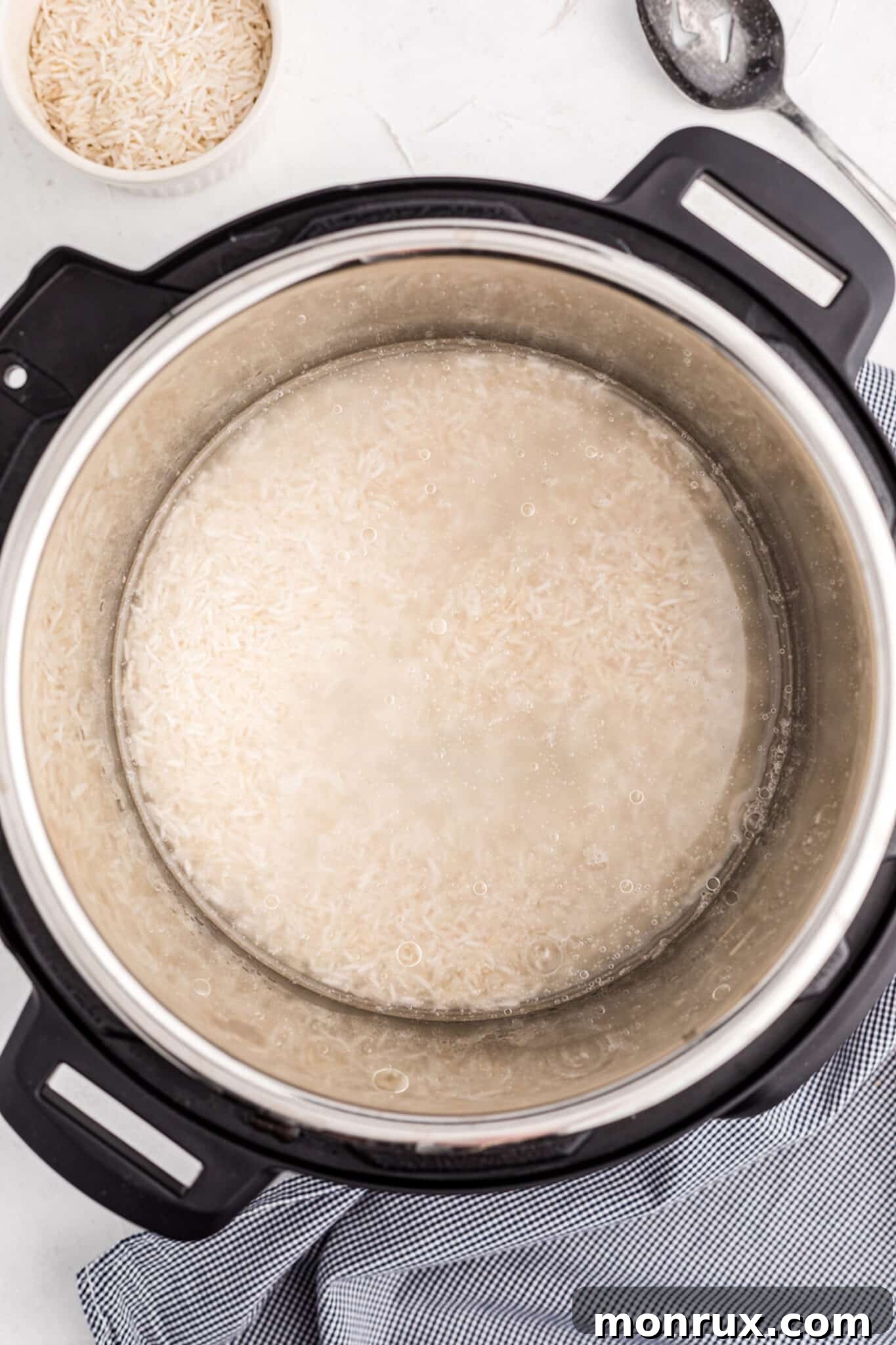Well-rinsed white Basmati rice resting in the Instant Pot liner, ready for cooking.