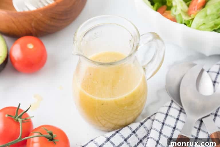 A beautifully composed shot of a glass jar filled with luscious honey mustard dressing, ready to be served.