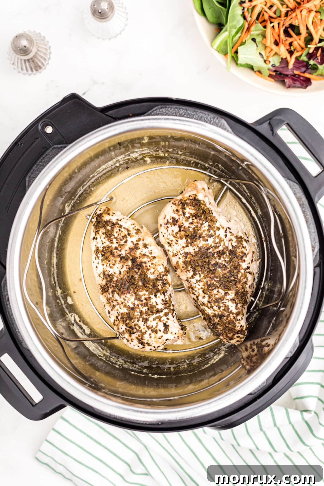 Perfectly cooked turkey tenderloins resting inside the Instant Pot after pressure cooking.
