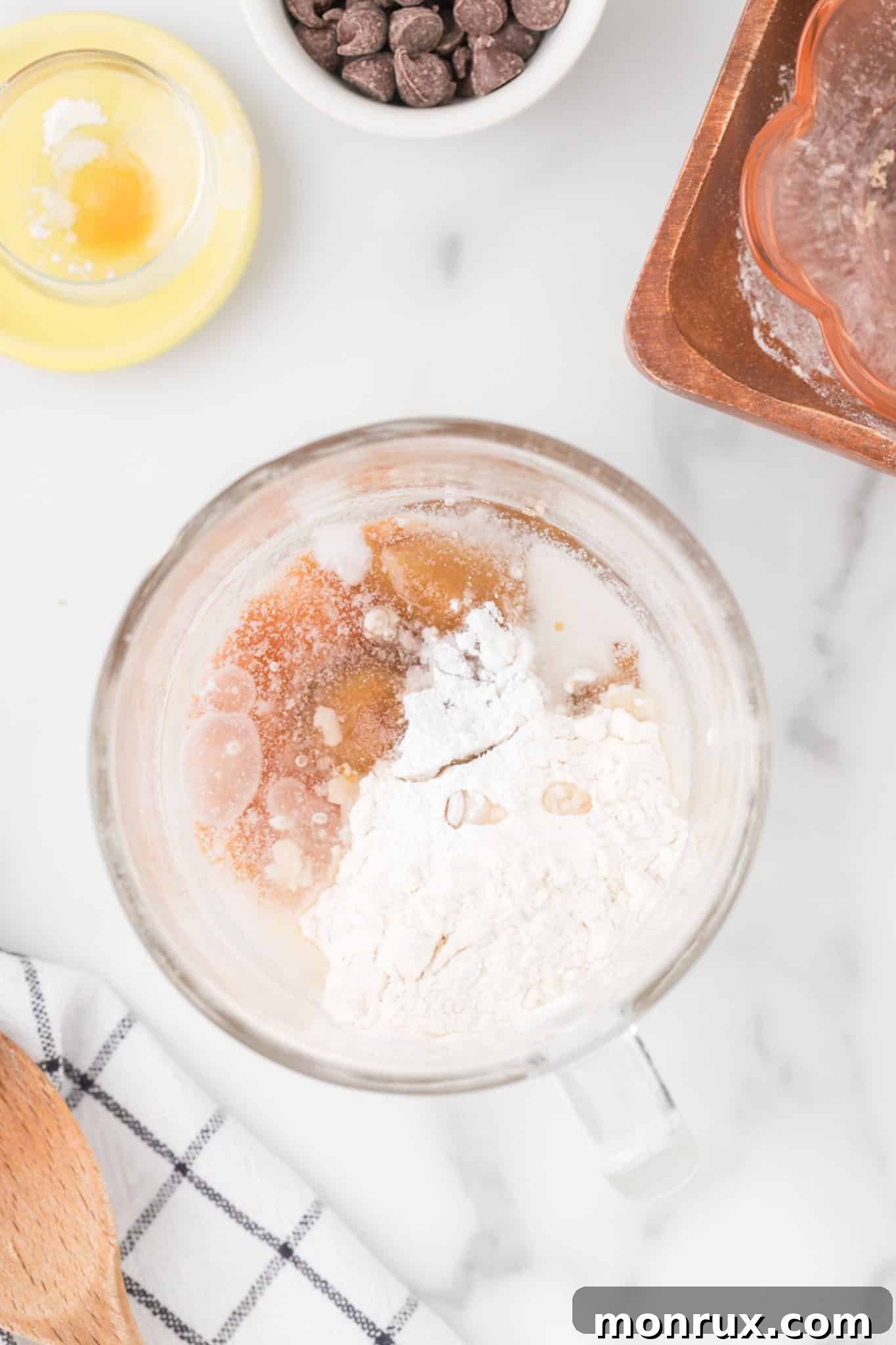The mug cake ingredients being stirred together to form a batter.