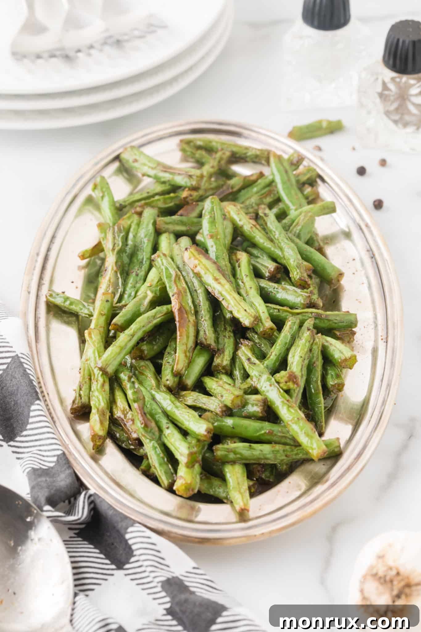 serving plate with cooked air fryer green beans.