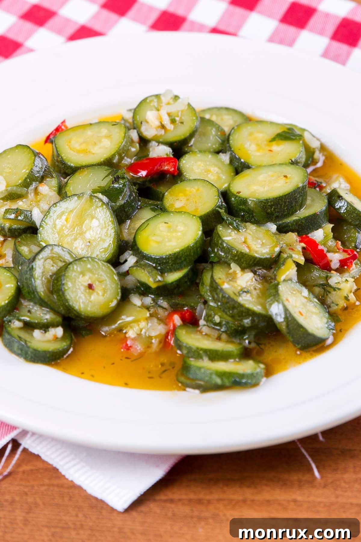 Close-up of steamed Instant Pot zucchini seasoned with fresh garlic and herbs.