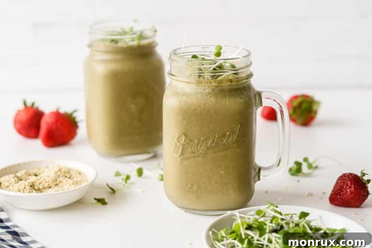 Two glasses of nutritious broccoli sprout smoothie, ready to be served and enjoyed for a healthy boost.