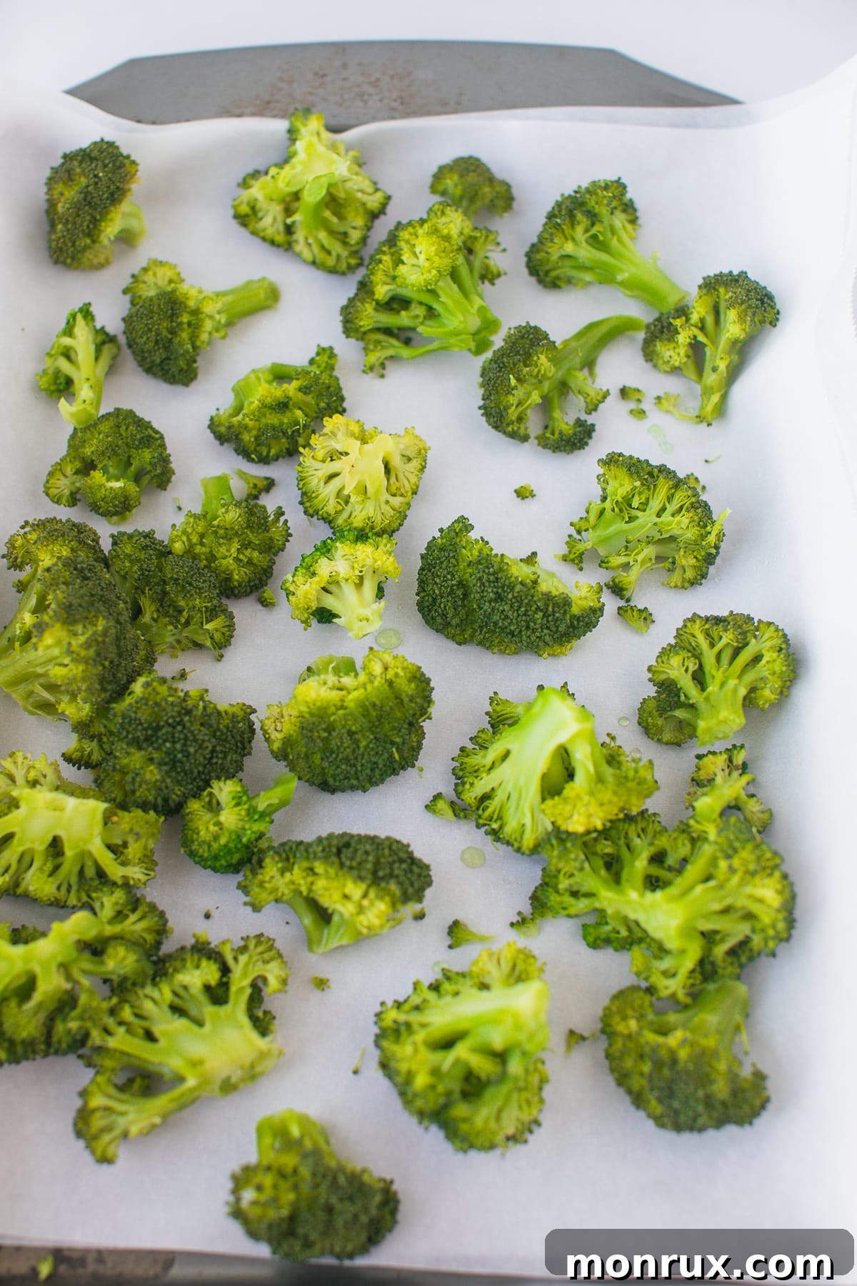 blanched broccoli on baking sheet.