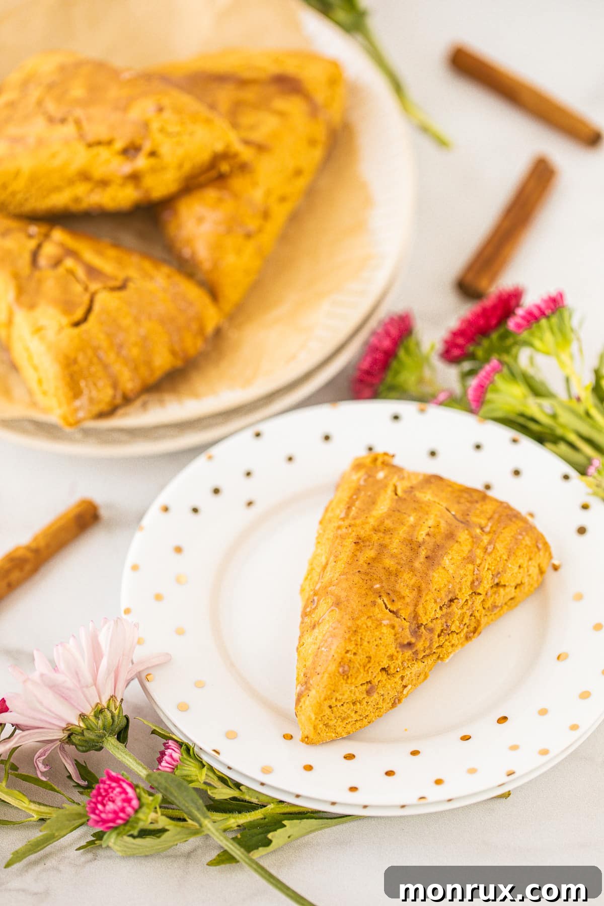 A beautifully presented homemade scone served on an elegant plate, ready to be enjoyed.