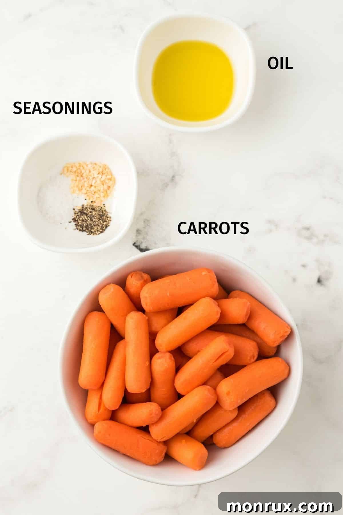 Photo displaying labeled ingredients: baby carrots, olive oil, salt, pepper, and garlic powder.