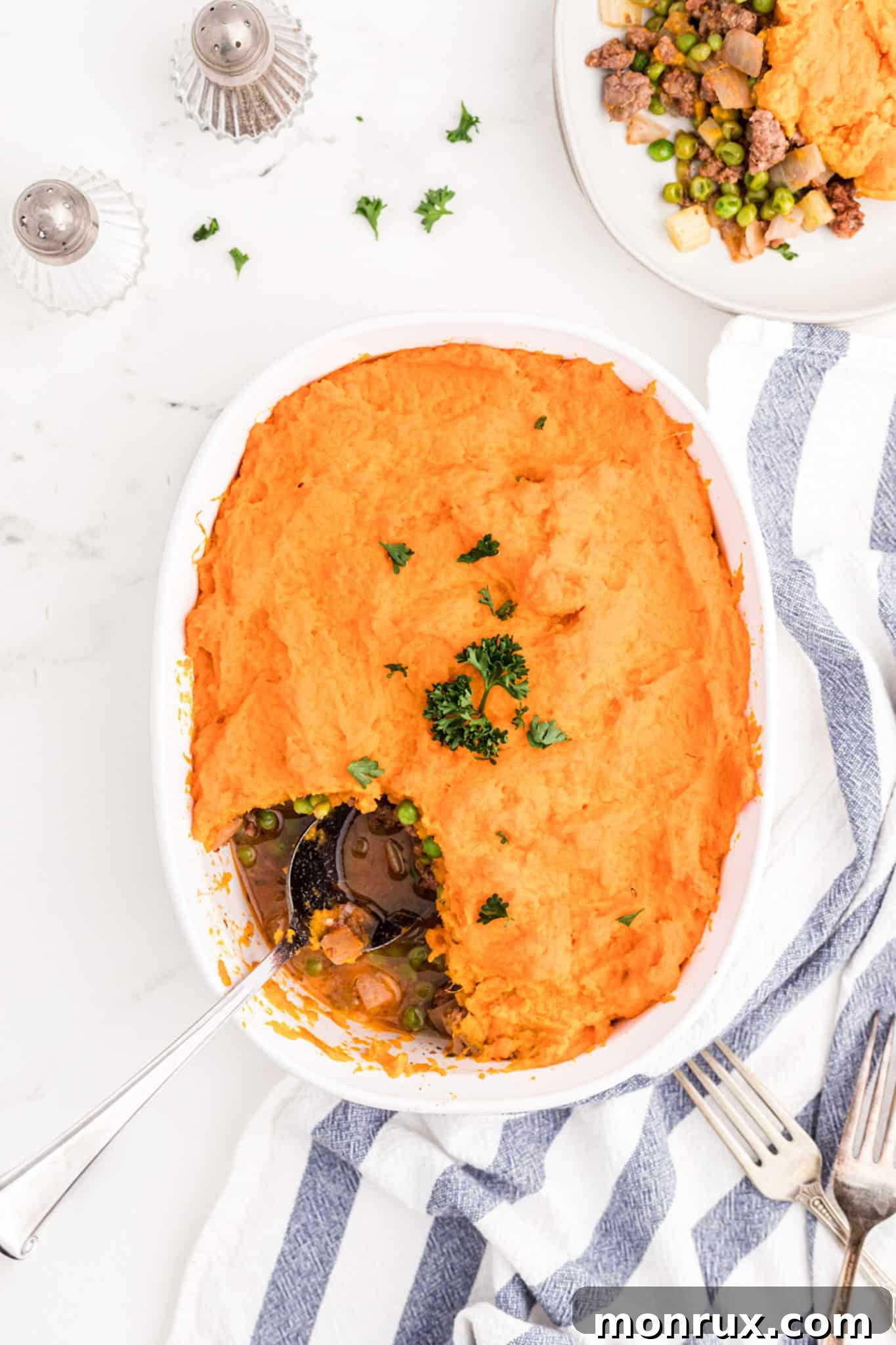 shepherd's pie on table with serving spoon