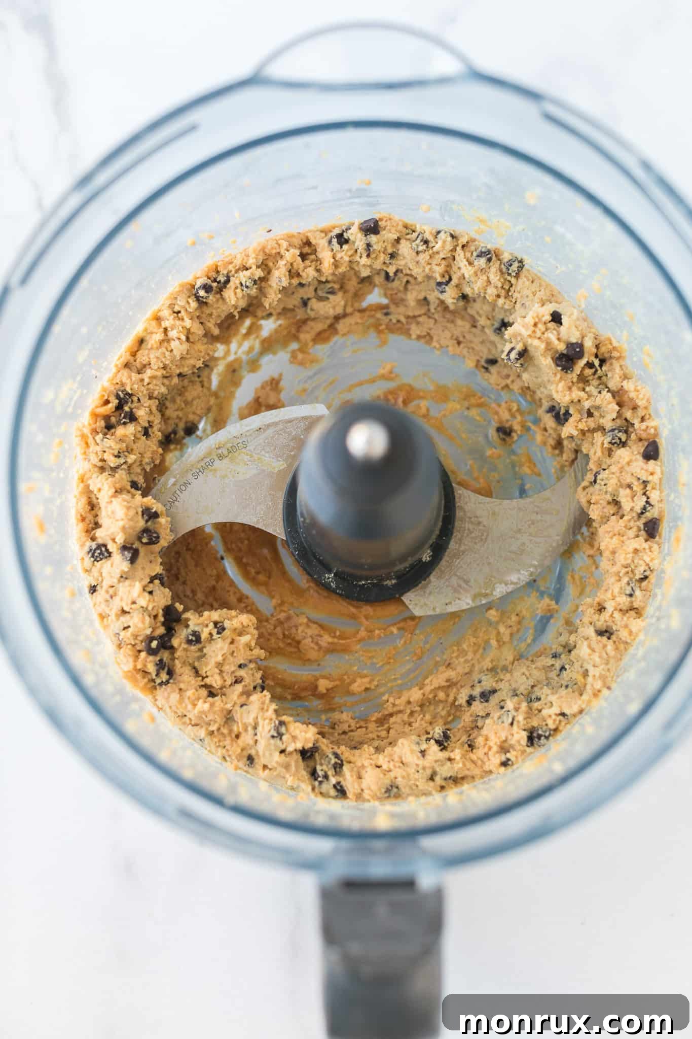 cookie dough mixed together in a food processor.