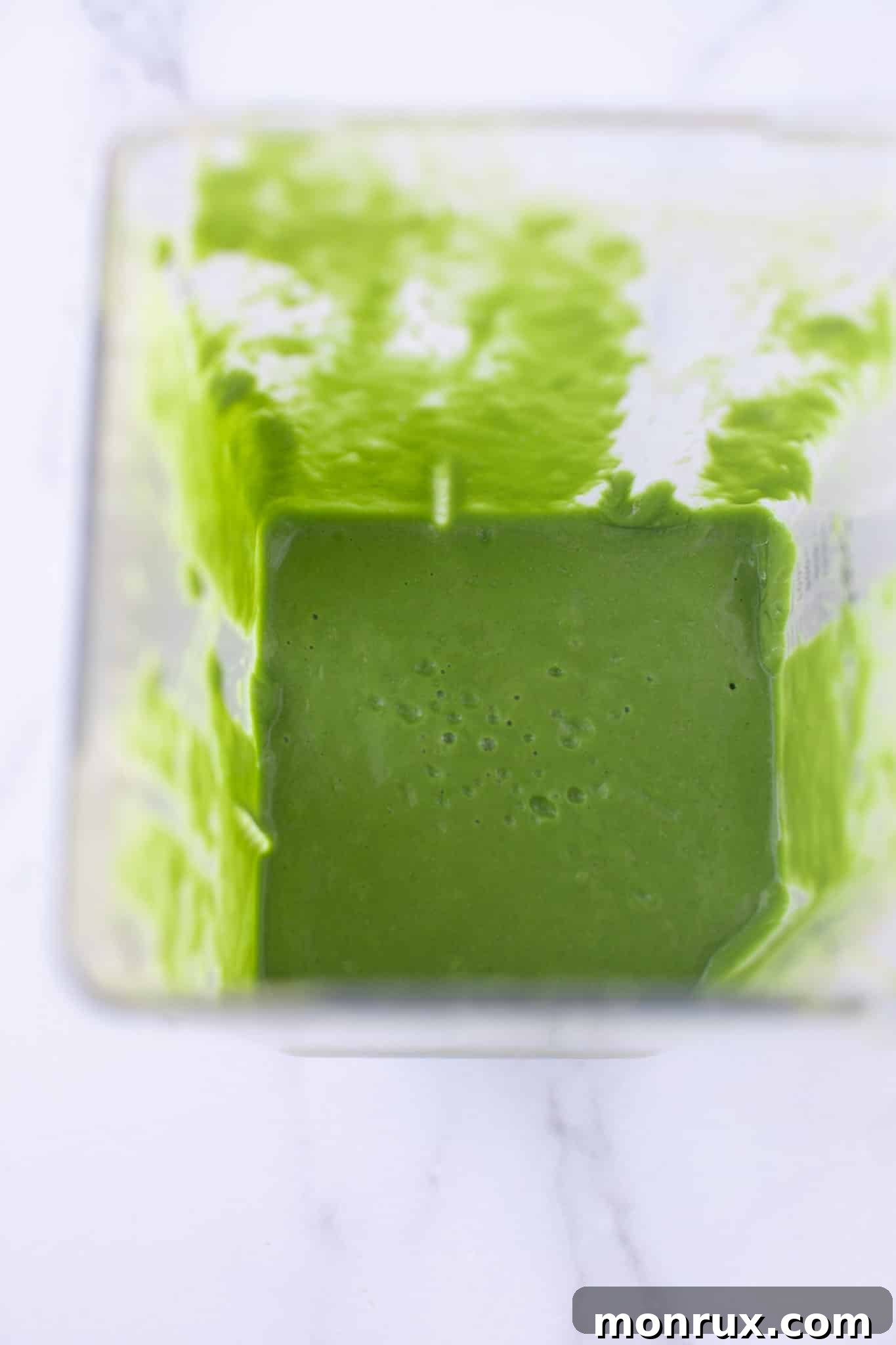 Smoothie fully blended and ready for serving, still in the blender pitcher.