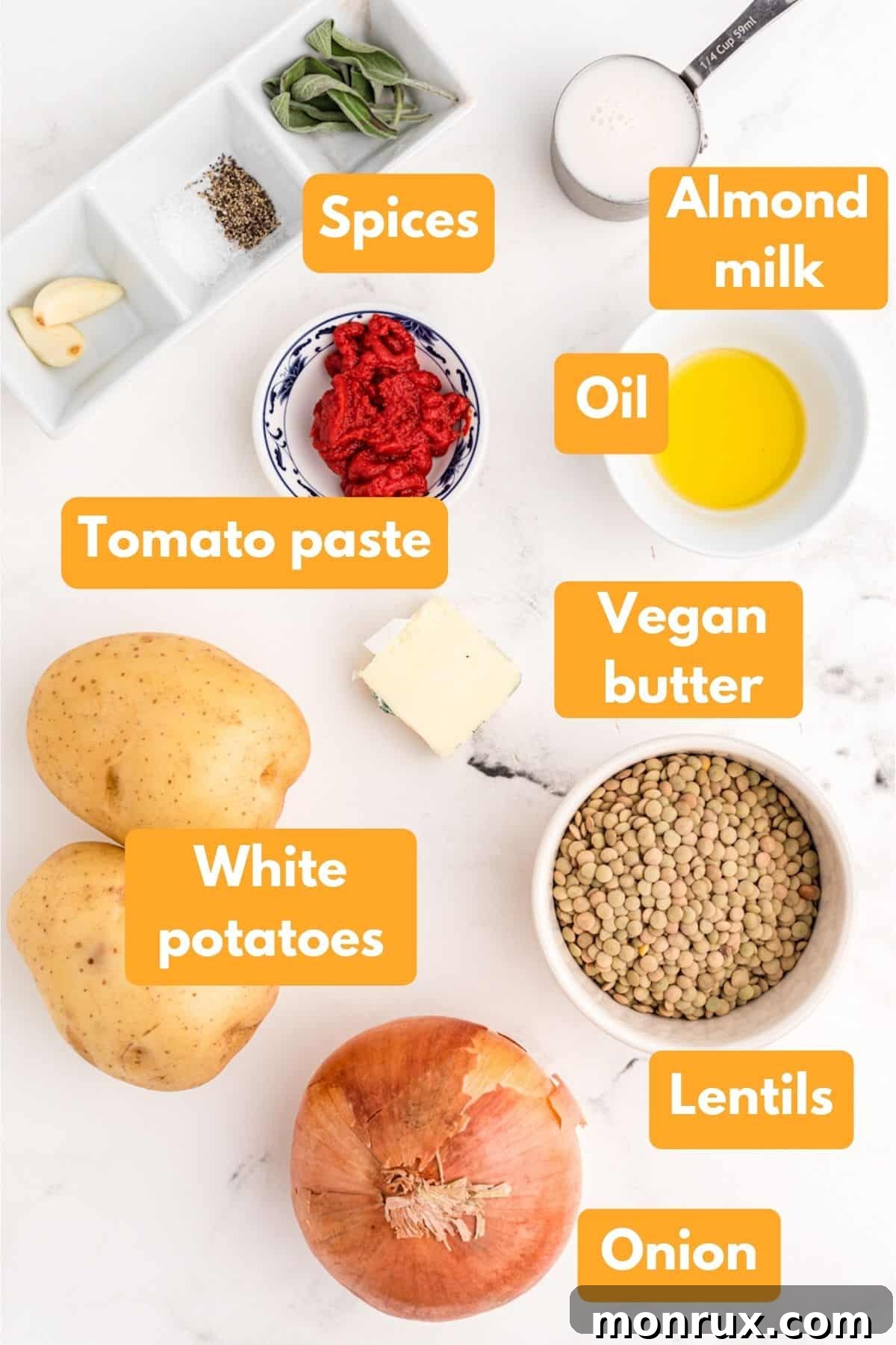 A curated selection of fresh, wholesome ingredients arranged for making vegan shepherd's pie with lentils.