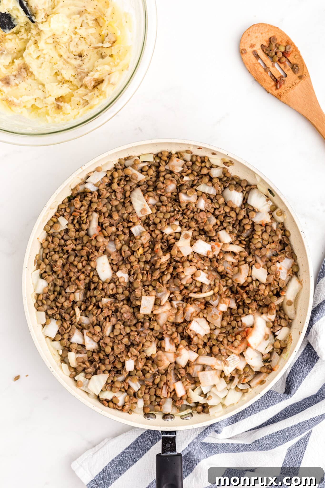 Sautéed onions and garlic mixed with cooked lentils for the shepherd's pie filling.