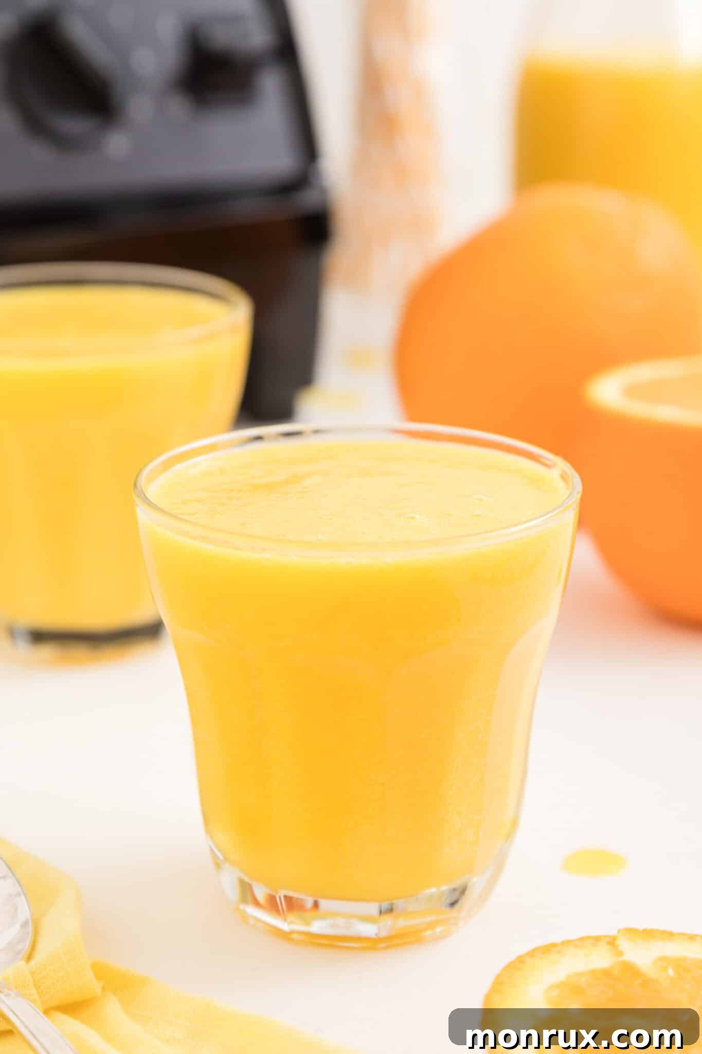 vitamix blended orange juice served in glass.