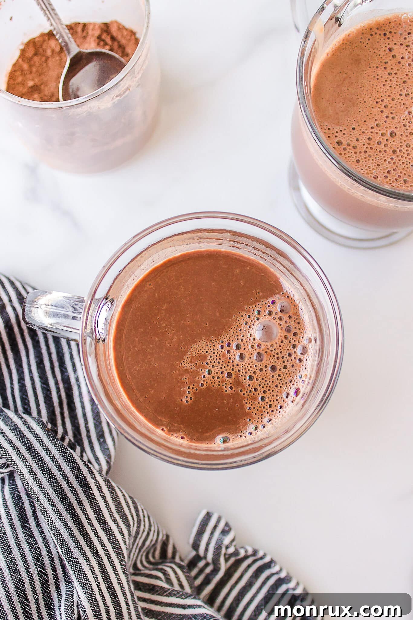 A mug of steaming hot chocolate, freshly prepared without milk, ready to be served and enjoyed.