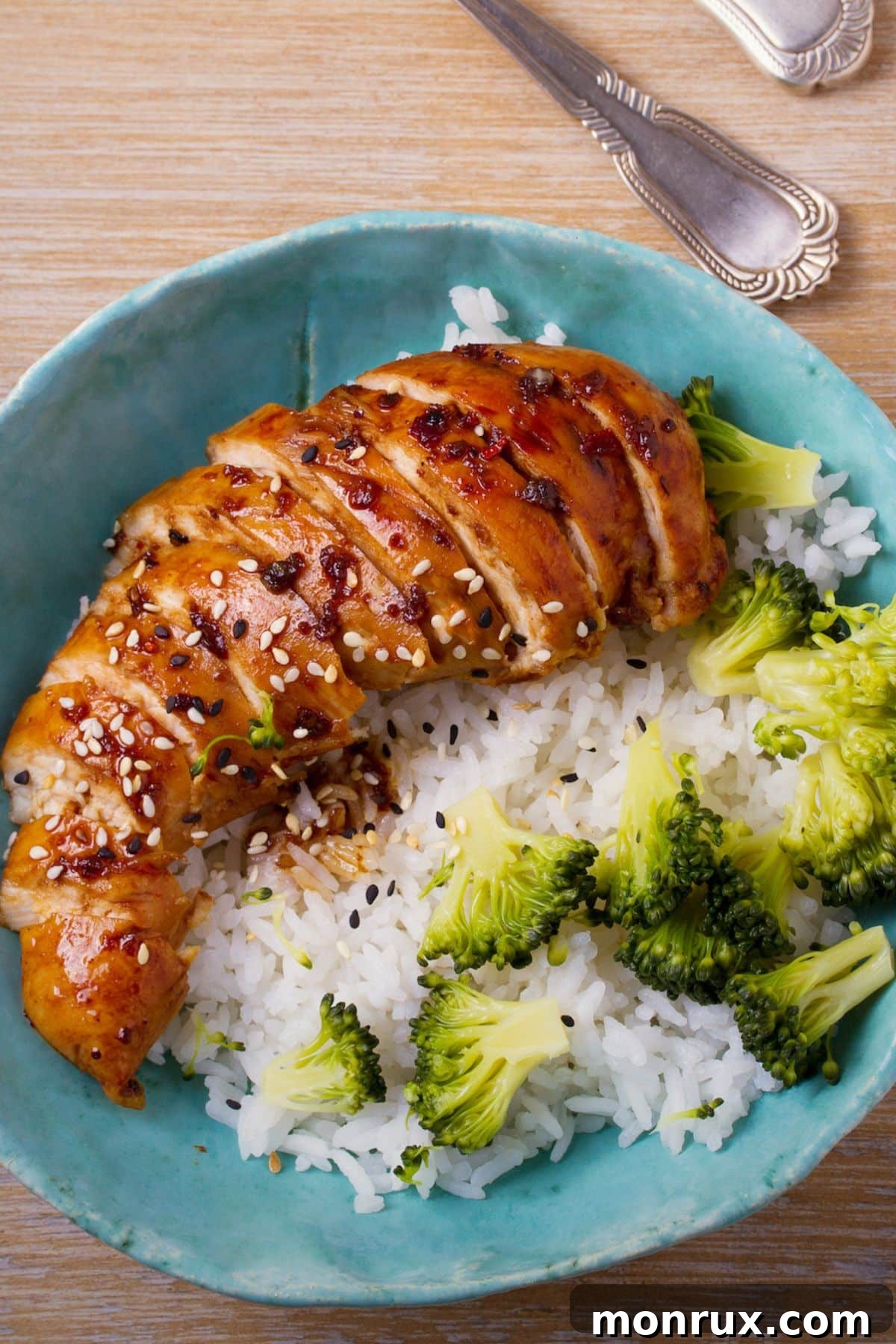 Perfectly cooked air fryer teriyaki chicken breast served with rice.