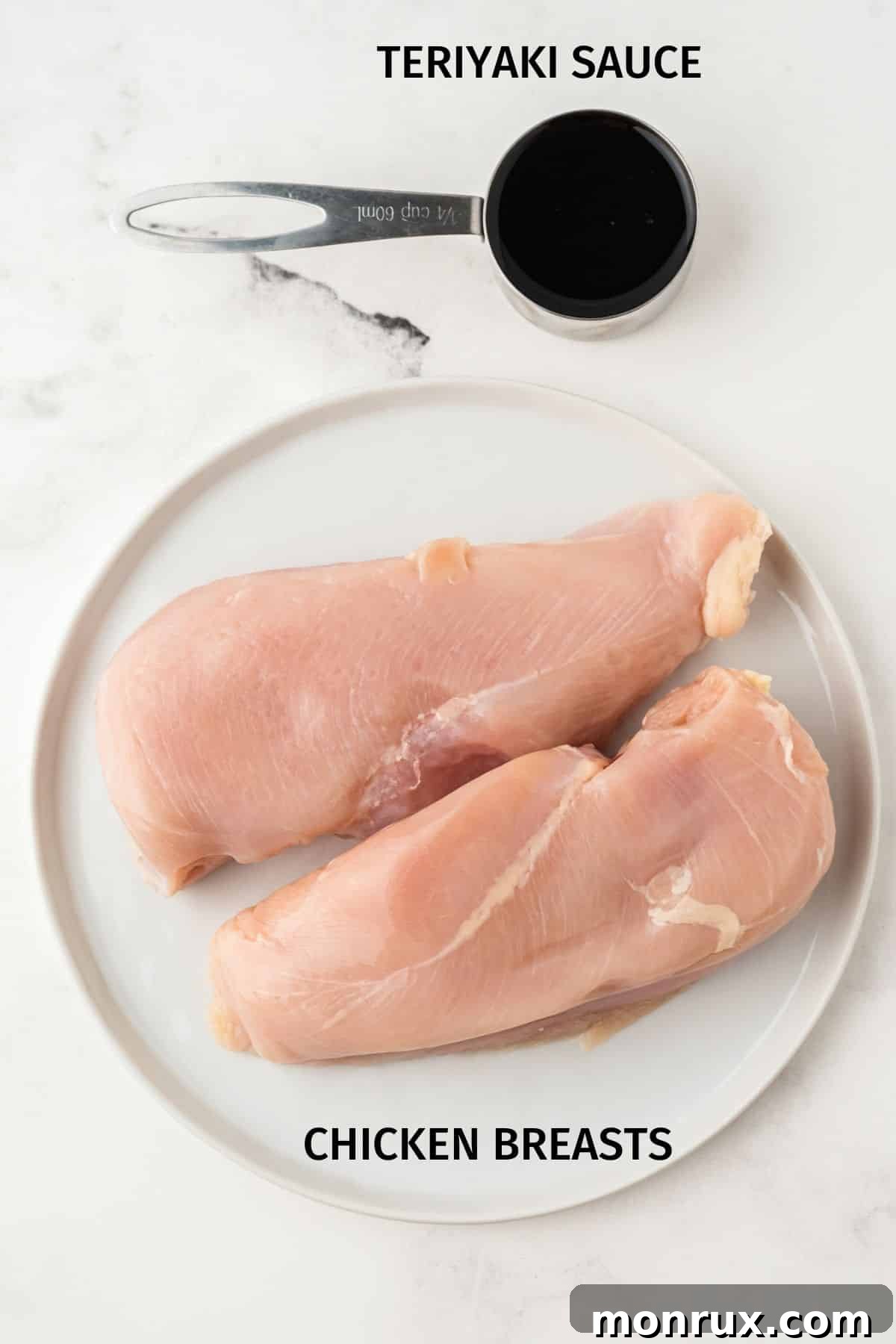 Ingredients for air fryer teriyaki chicken including chicken breasts and teriyaki sauce, labeled.