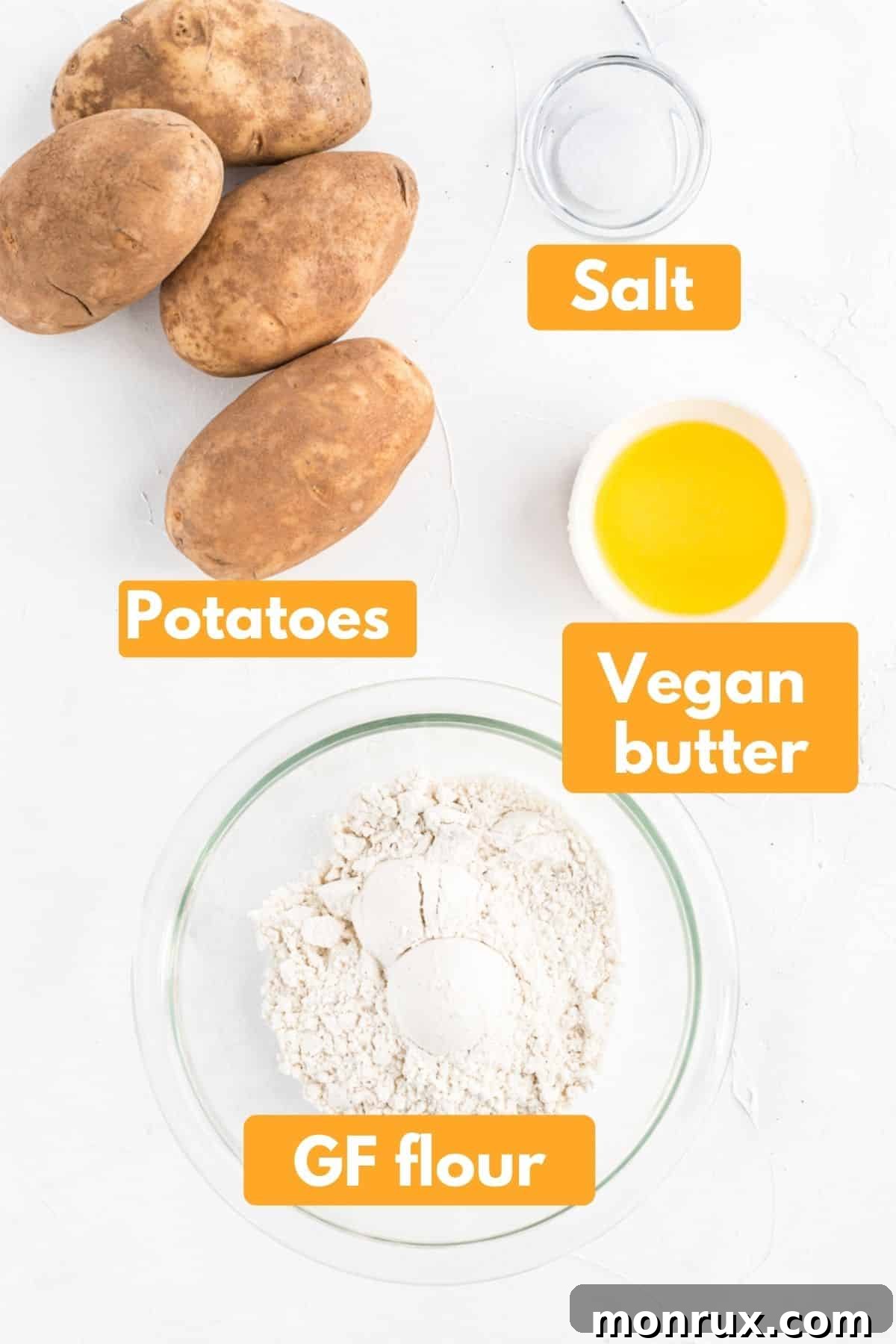 Ingredients laid out for making homemade gluten-free gnocchi, including Russet potatoes, a bag of gluten-free flour, and a block of vegan butter, all labeled clearly.