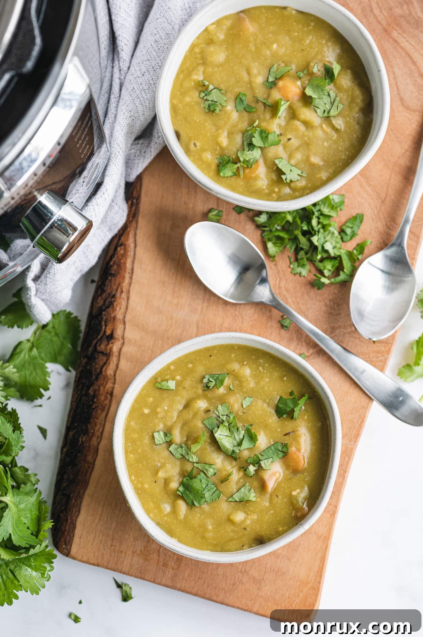 Two inviting bowls of Instant Pot Split Pea and Ham Soup, beautifully presented and ready to be enjoyed.