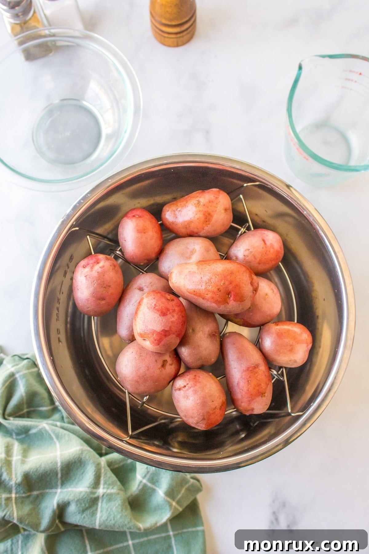 red potatoes ready to be boiled inside instant pot pressure cooker.