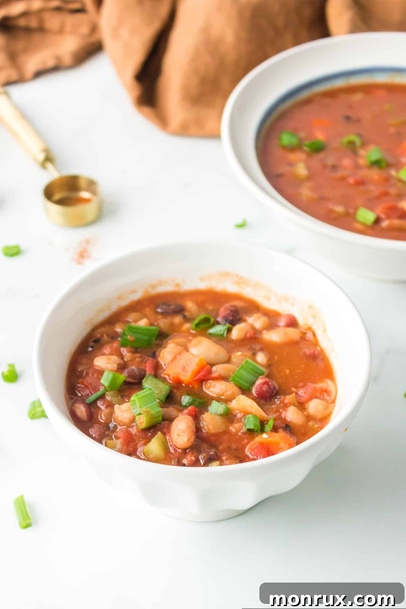 two bowls of cooked instant pot 15 bean soup.