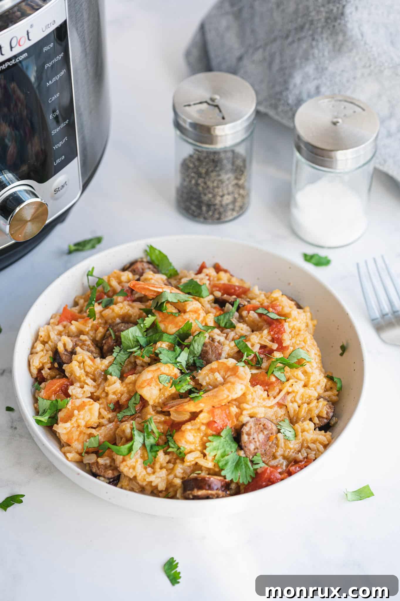 A steaming bowl of Instant Pot Jambalaya, rich with sausage, tender shrimp, and perfectly cooked rice.