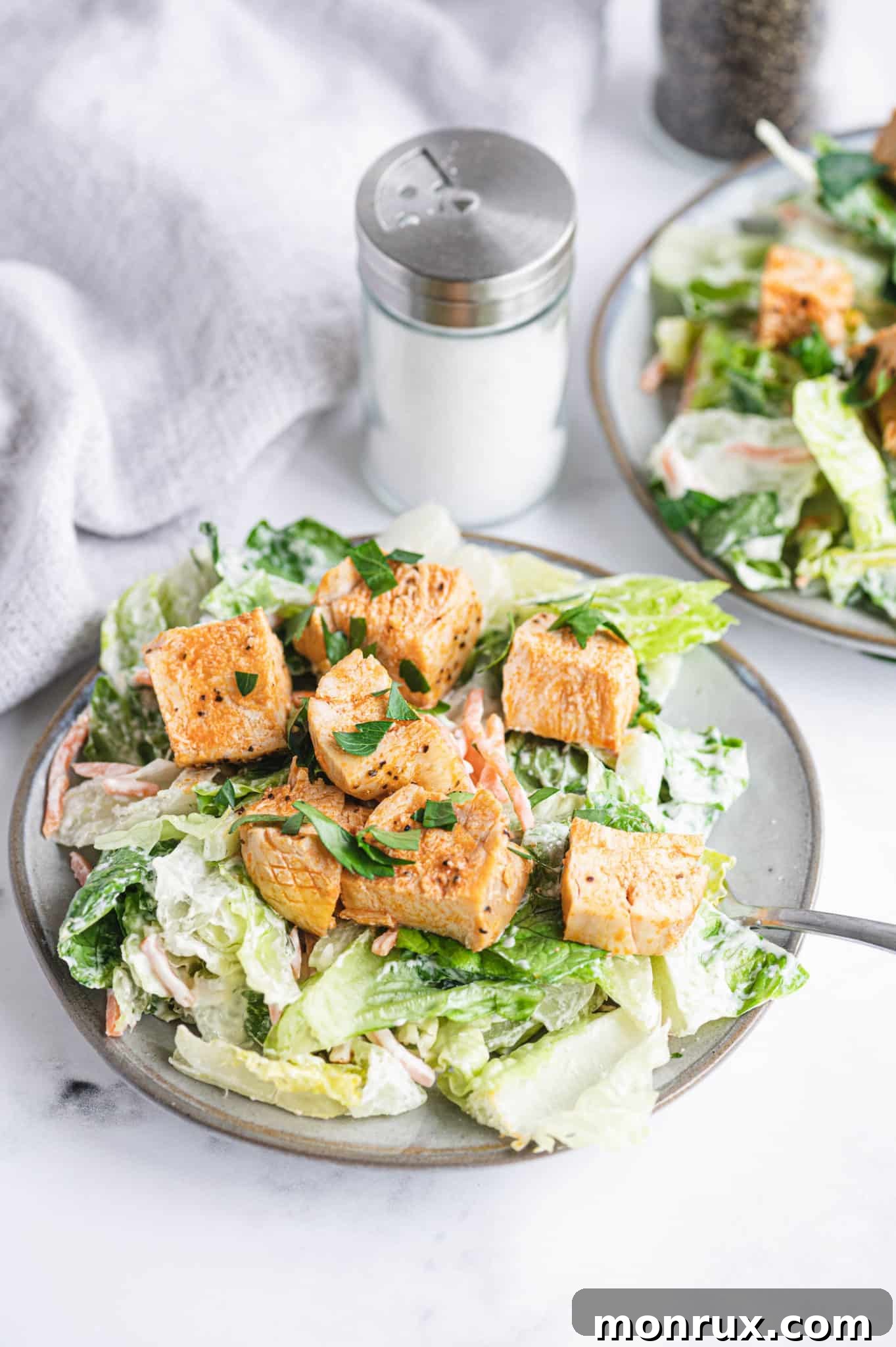 A vibrant plate of Whole30 Buffalo Chicken Salad featuring crisp romaine, tender buffalo chicken, and a creamy dressing.