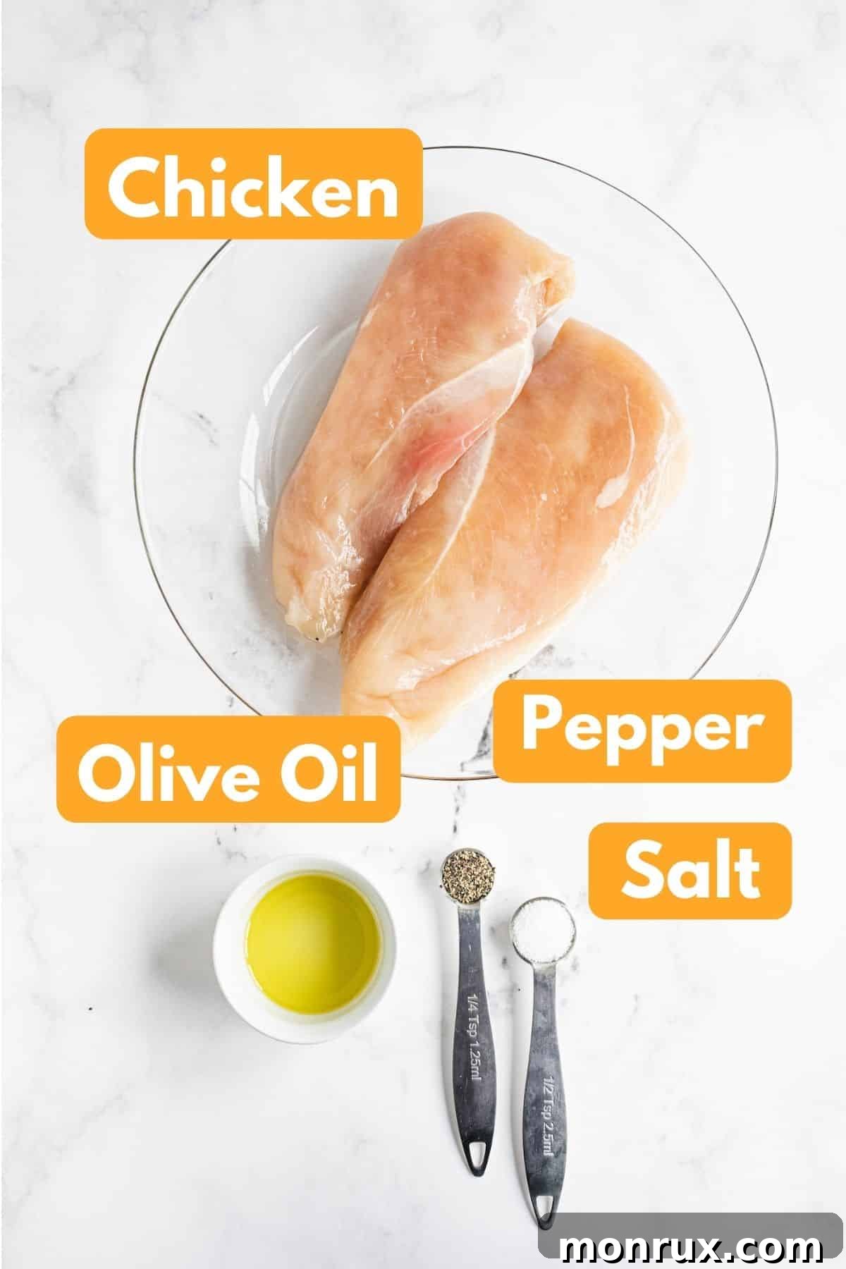 Fresh ingredients laid out for cooking chicken breast for a healthy salad.