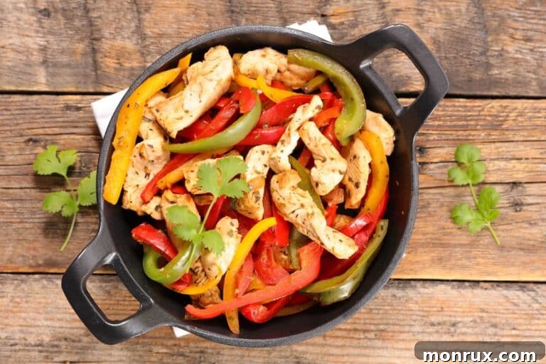 Keto chicken fajitas served in cast iron skillet.