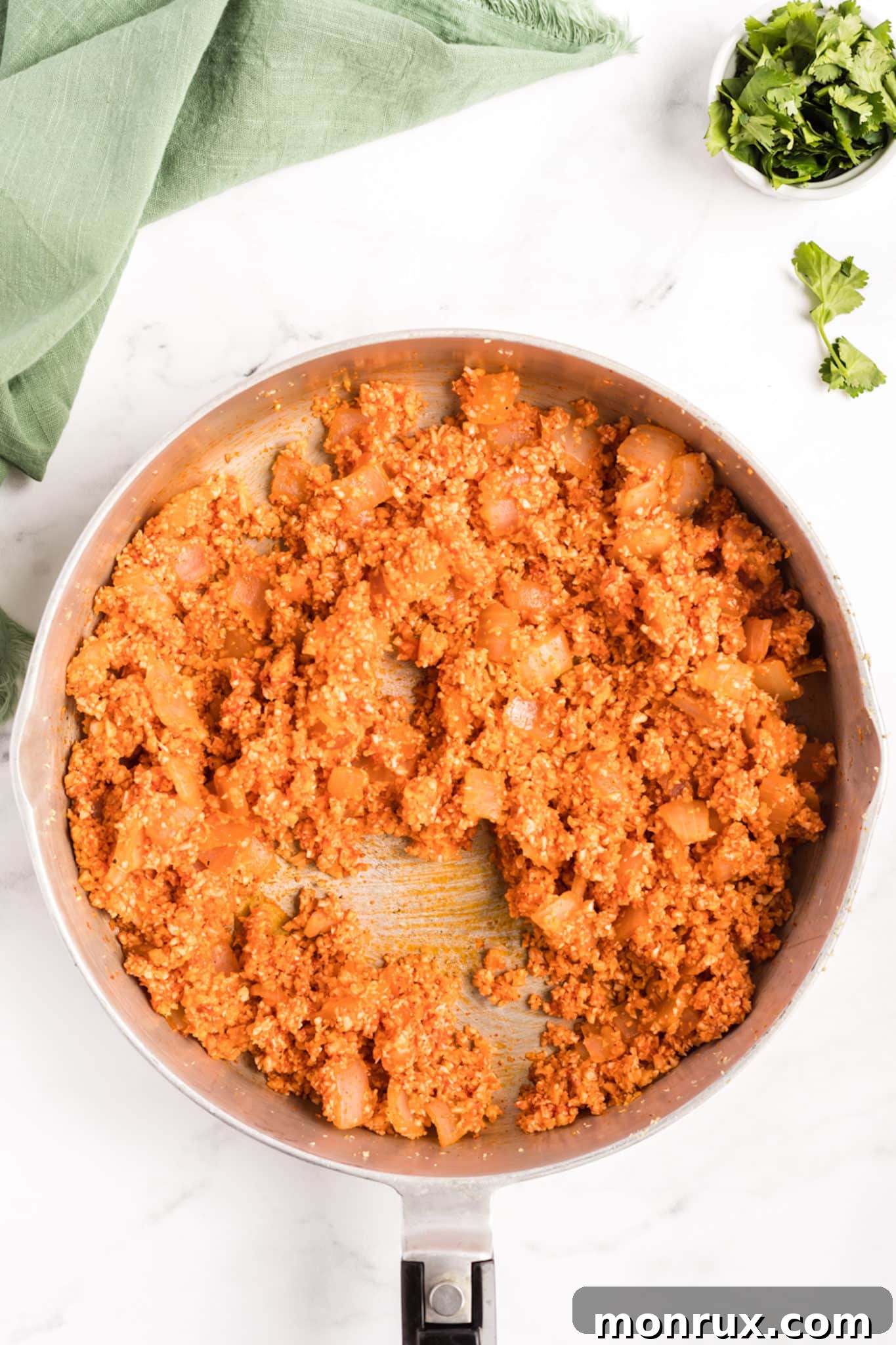 A skillet with keto spanish rice in it