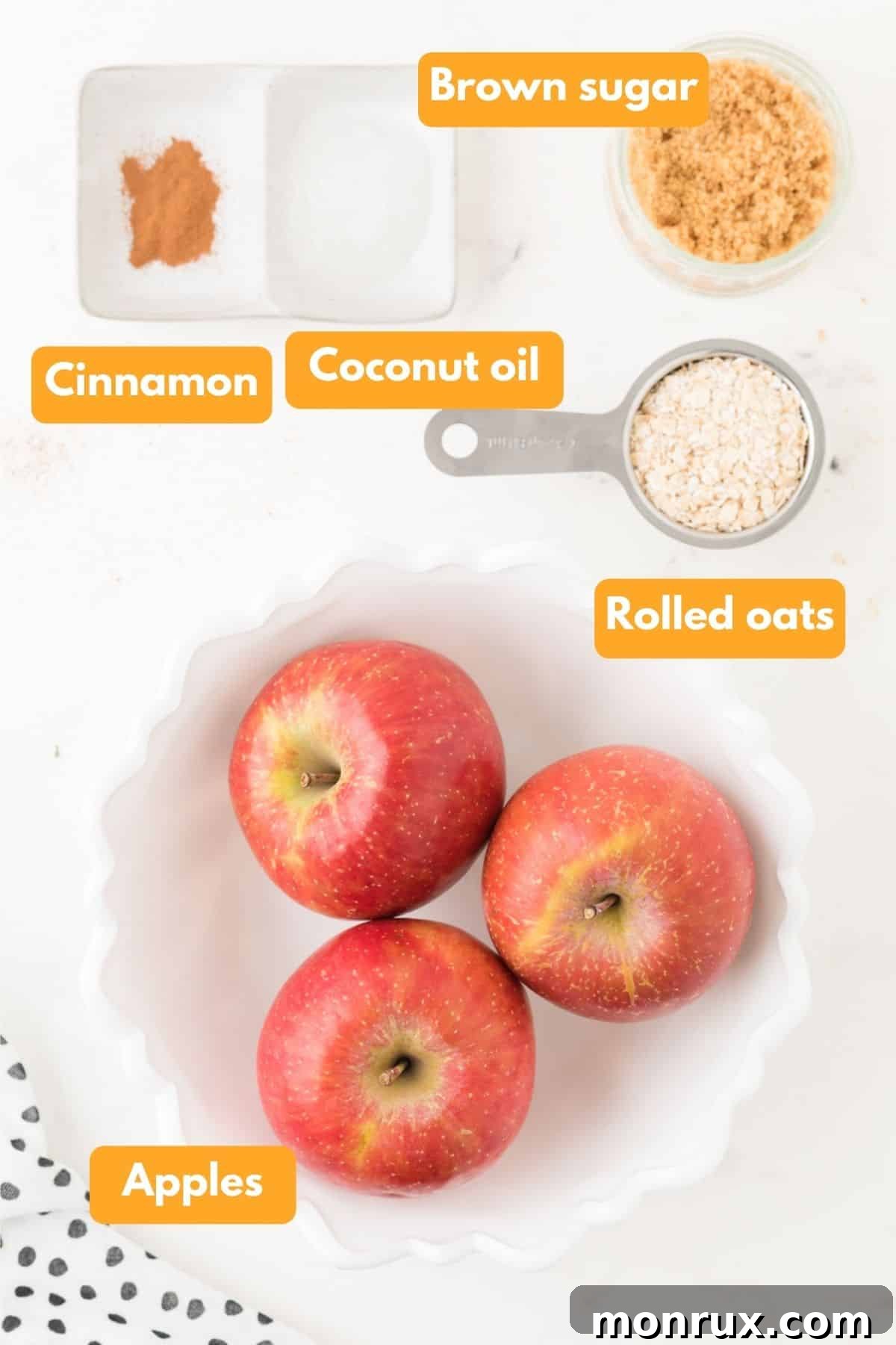 Ingredients for air fryer apples and oat filling laid out on a wooden surface.