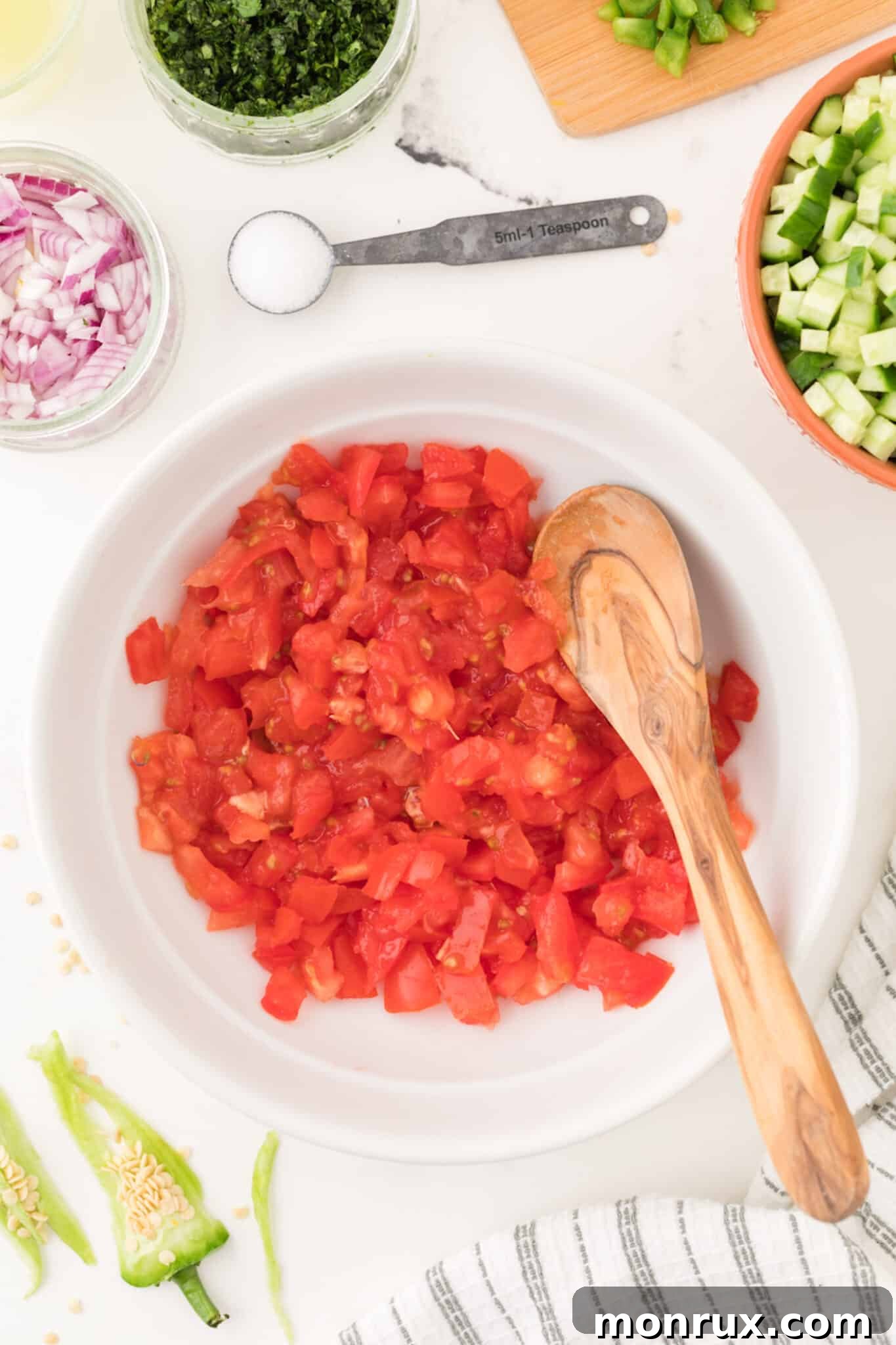 chopped tomatoes in a bowl, ready for the pico de gallo recipe.