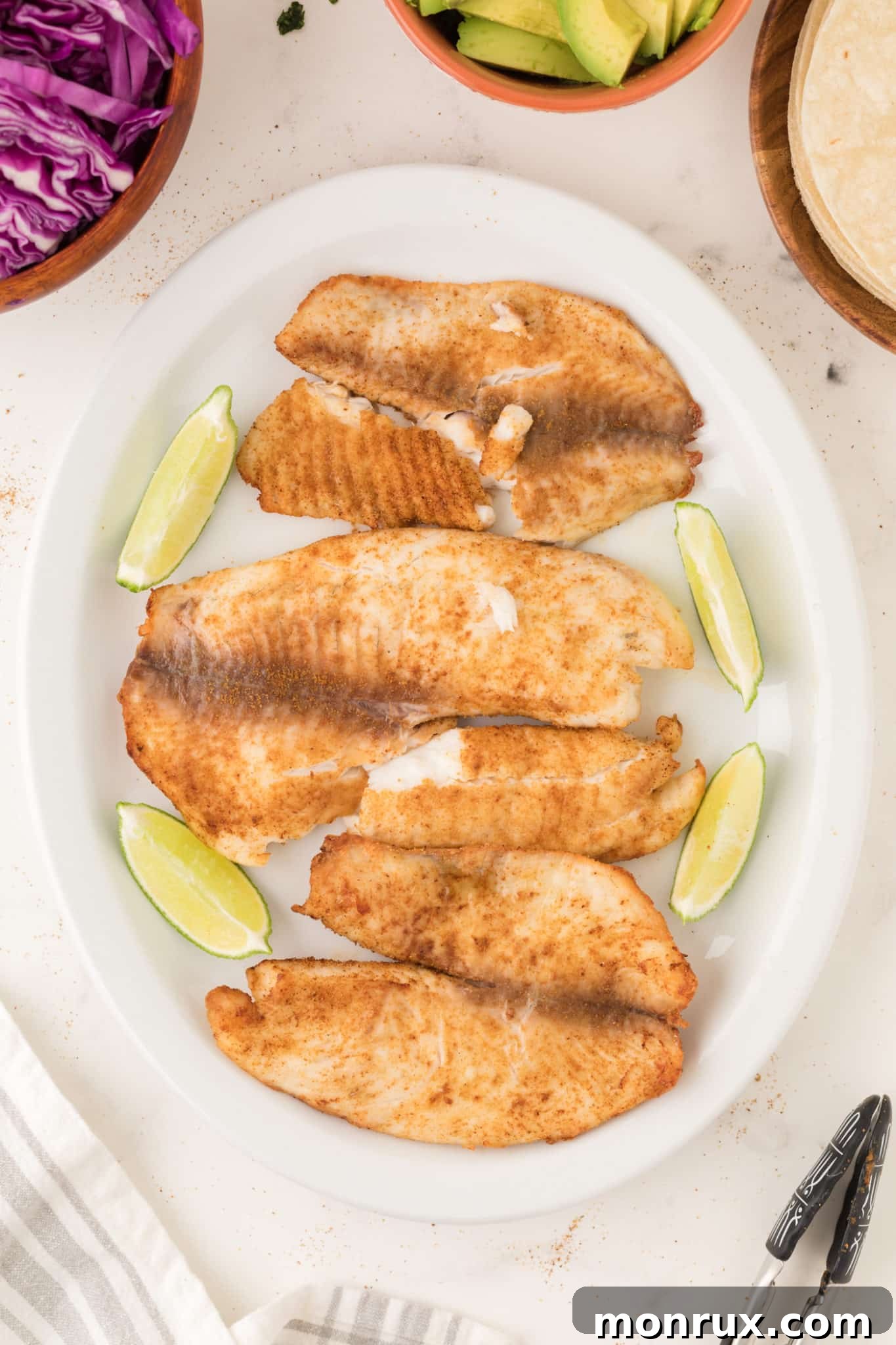 air fryer tilapia served on a plate.