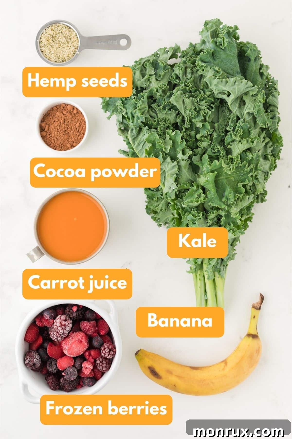 Ingredients for a chocolate berry kale smoothie on a table