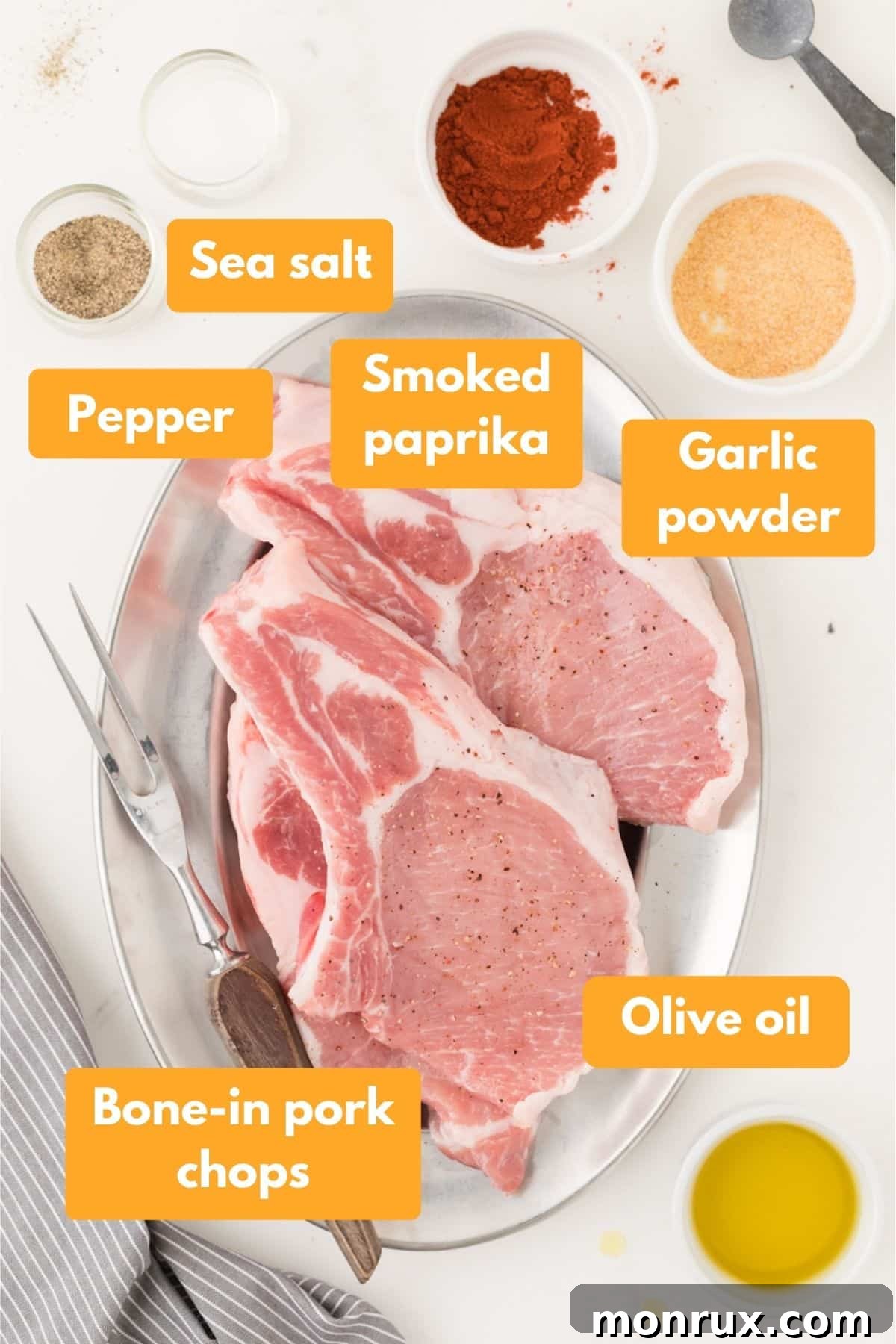 Air fryer pork chop ingredients including bone-in pork chops, olive oil, and various spices.