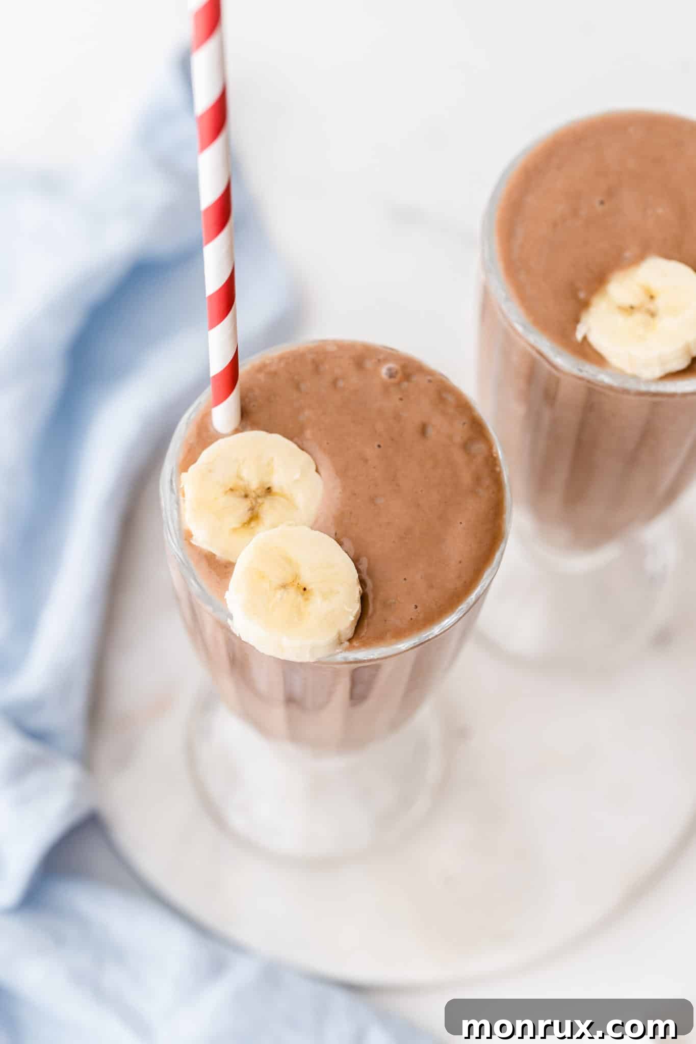Close up of a rich chocolate avocado smoothie in a glass.