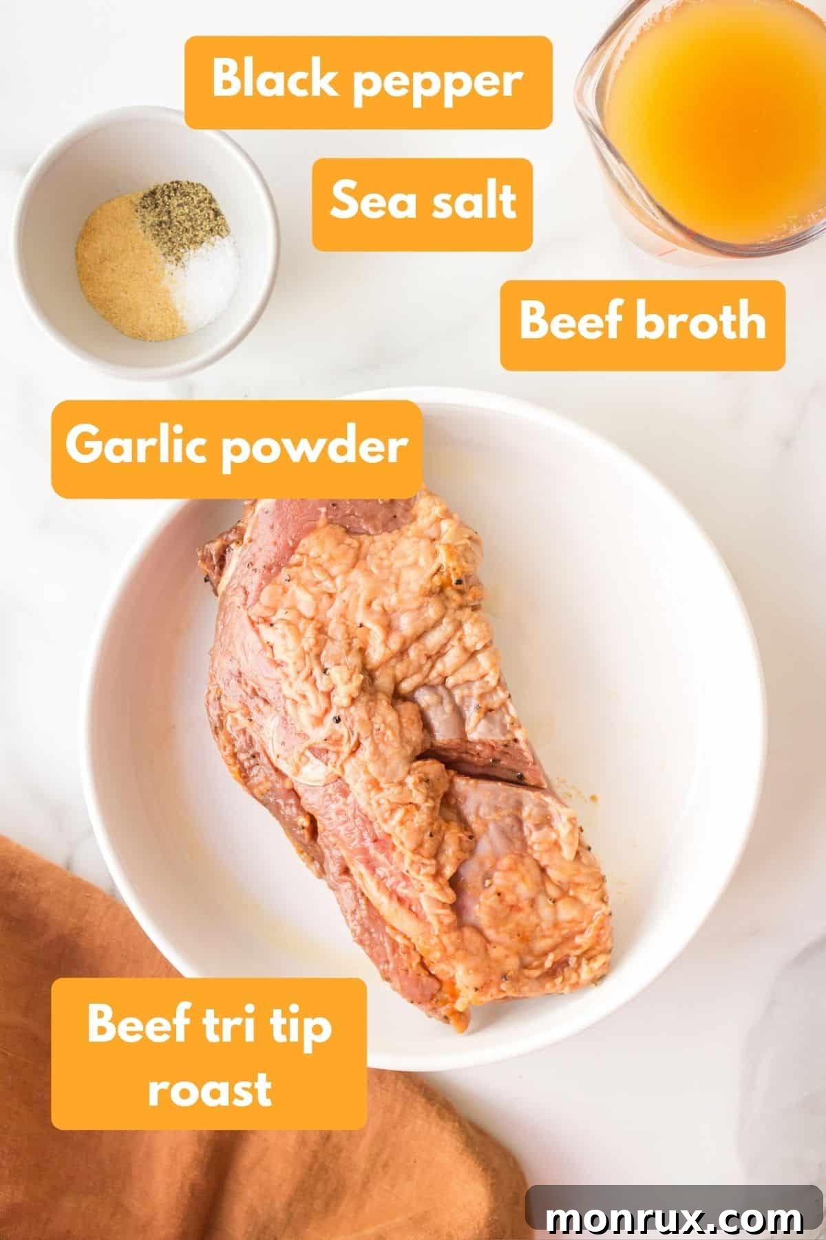 Fresh ingredients laid out for Instant Pot Tri-Tip, including a seasoned roast, oil, and beef broth.