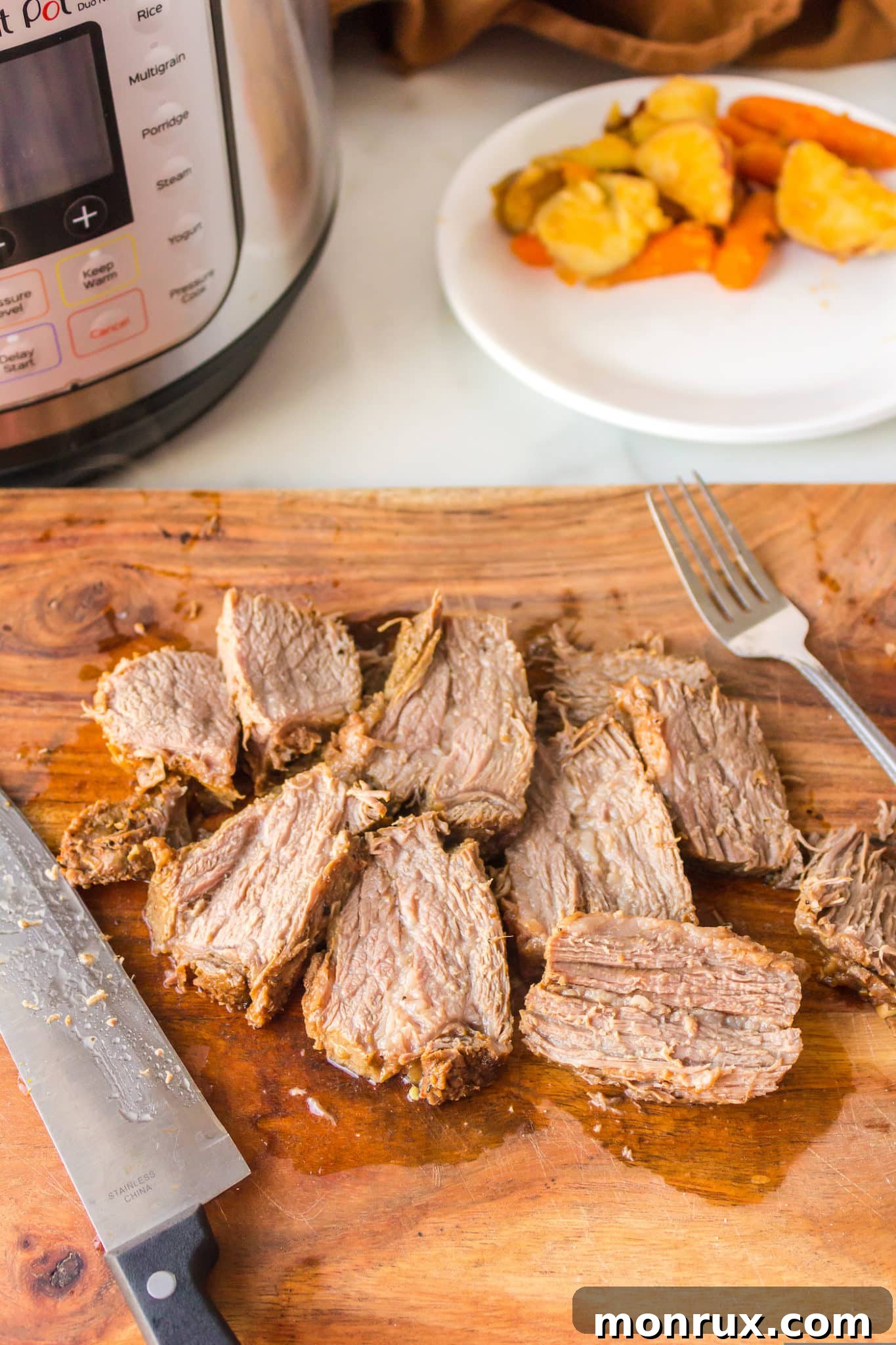 Perfectly sliced Instant Pot Tri-Tip roast on a cutting board, ready to serve.