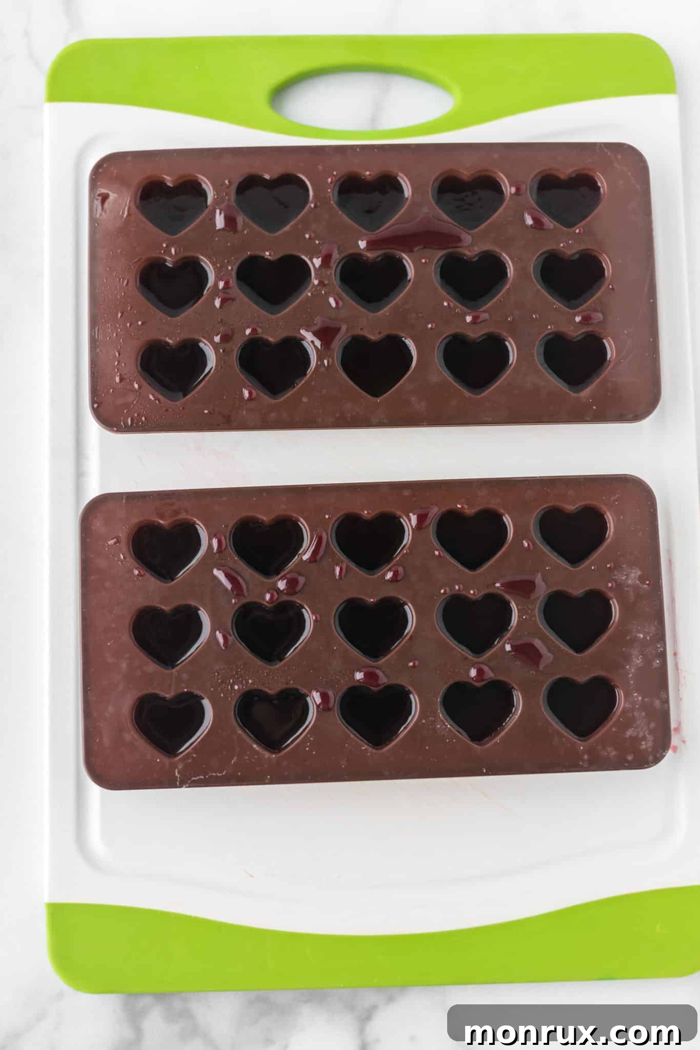 gummy mixture in heart shaped molds