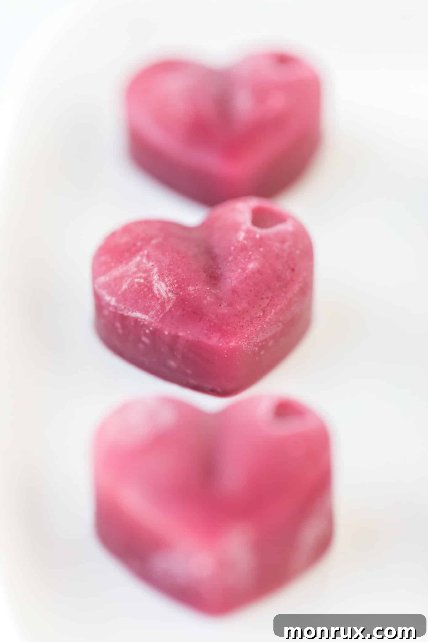 pink heart gummies on a plate