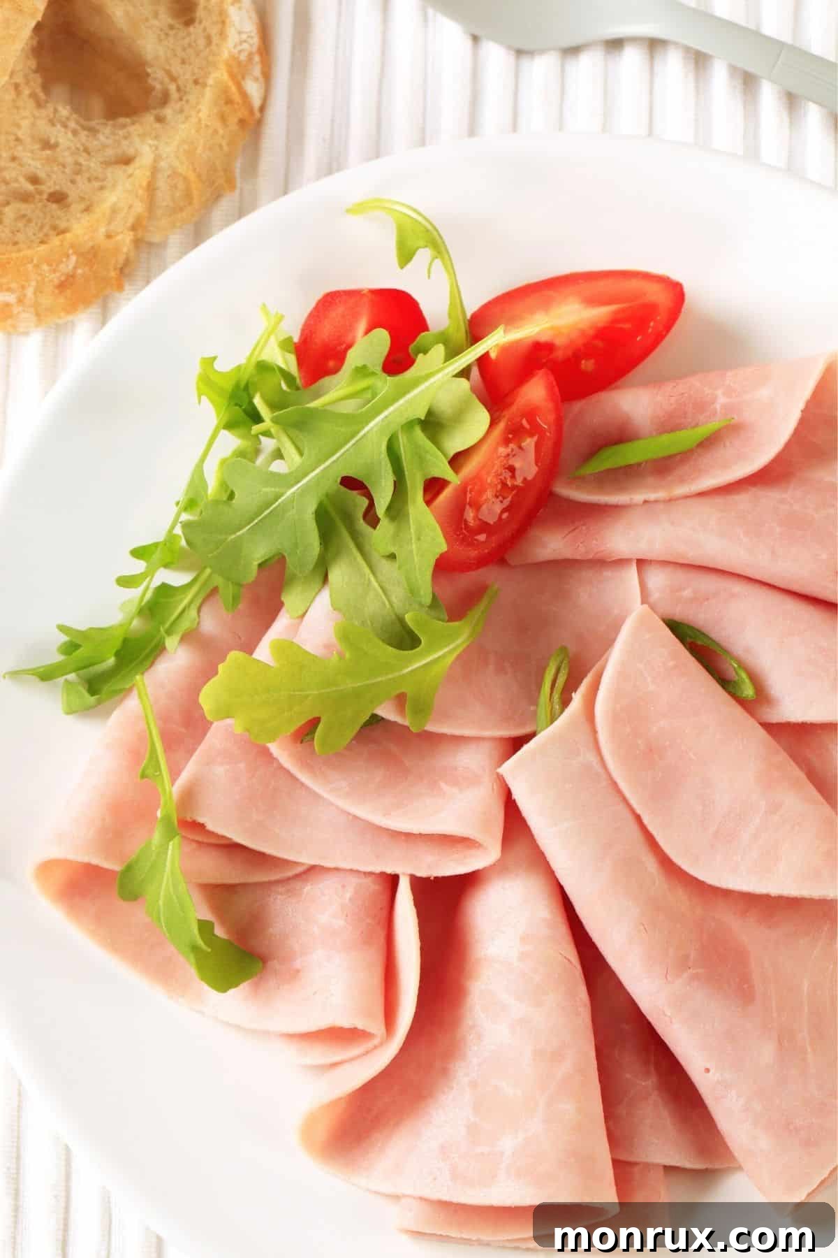 Thinly sliced turkey breast neatly arranged on a white plate, ready to be enjoyed as a light and healthy snack.